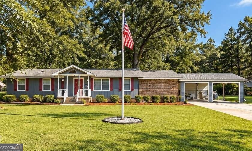 Photo of 1881 Flat Shoals Road SW, Conyers, GA 30094 (MLS # 10868165)