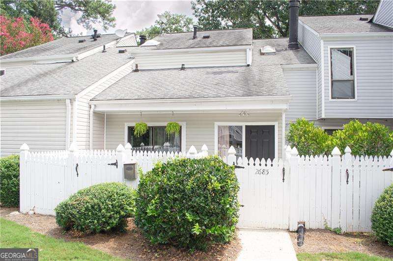 Welcome to this beautifully maintained 2 bed, 1.5 bath condo offering comfort, convenience, and charm. Thoughtfully updated throughout, this home features tall ceilings, spacious living areas, and stylish finishes that make it truly move-in ready. Enjoy two private fenced patios - one in the front and one in the back - perfect for relaxing, entertaining, or gardening. The layout of this home creates a warm, inviting atmosphere while maximizing functionality. Nestled in a well-kept community, yet just minutes from highways, shopping, schools, and everyday conveniences, this property strikes the perfect balance of peace and accessibility. Whether you're looking for a new place to call home or an excellent investment opportunity with long-term rental potential, this condo is a MUST-SEE!