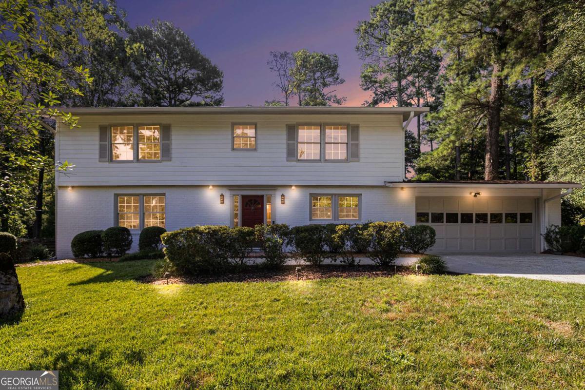This beautifully updated and refreshed Mid-Century Traditional blends timeless design with fresh, modern style in one of Atlanta's most iconic neighborhoods, Historic Northcrest! With unbeatable access to both I-85 and I-285, you're just minutes from Chamblee, Brookhaven, Downtown, and more - making it a truly prime location. You'll feel right at home the moment you arrive, welcomed by a well-manicured yard, inviting curb appeal and oversized two-car garage - a rarity for Northcrest! Step inside to find stylish new tile flooring, new carpet on the main level, and beautifully refinished original red oak hardwoods upstairs. Cared for and well-maintained, the BRAND NEW white kitchen with soft-close cabinetry, sleek Quartz countertops, and new stainless steel appliances - including a gas cooktop, custom vent hood, eat-in breakfast area and functional island with added storage - this is the heart of the home! Upstairs, you'll find four bedrooms and two full baths, plus ample storage options throughout. One of the secondary bedrooms even features a charming 1950s-style vanity counter, adding a touch of vintage glamour. Freshly painted inside and out, the home seamlessly combines mid-century character with contemporary updates - from original teak built-ins and a retro-inspired entry fixture to updated lighting, wrought iron spindles, and a modernized kitchen. Wind your day down on your patio overlooking your private plush backyard (complete with new 4-zone watering system) - your own little slice of heaven! Don't miss the opportunity to join Northcrest Swim & Tennis Club with access to 7+ acres of sports and nature areas, tennis and pickleball, the tiki hut and of course, the pool!