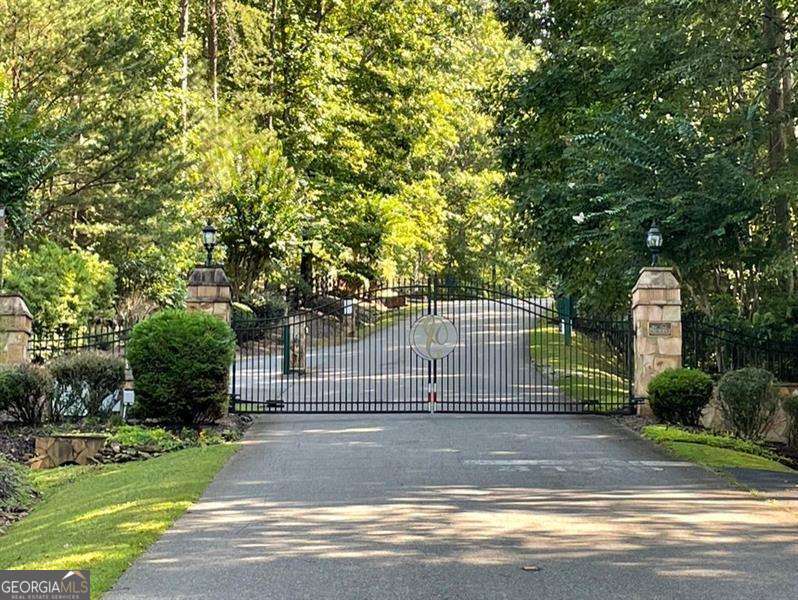Discover your dream homesite nestled within the serene beauty of The Preserve at Sharp Mountain, a prestigious gated community offering a lifestyle of unparalleled tranquility and natural splendor. This remarkable 22-acre estate lot is a canvas for your vision, promising a life of privacy and exclusivity. As you step onto this wooded haven, you'll immediately appreciate the sense of seclusion and the whispering tranquility of the trees. Envision your future custom-built masterpiece surrounded by the majestic hardwoods, offering a sanctuary of peace and privacy unlike any other. The Preserve at Sharp Mountain is not just a place to live; it's a community designed to embrace the outdoors enthusiast. Explore the pristine hiking trails that wind through the lush woodlands, connecting you with nature at every turn. Spend weekends picnicking in the community parks, creating cherished memories with family and friends While you'll revel in the privacy of this estate lot, the convenience of modern living is just moments away. All utilities are ready to be brought back from the street to serve your future home. The private roads within this gated enclave ensure that every journey begins and ends in peaceful seclusion. Beyond the gates of The Preserve at Sharp Mountain, you're only a short drive away from the heart of downtown Jasper, where charming shops, delectable dining, and community events await. For those who crave adventure, Highway 515 is within easy reach, providing access to the best of North Georgia's scenic landscapes. Now is the perfect time to turn your dream home into a reality in this thriving area. Create the custom residence you've always envisioned, surrounded by the serenity of The Preserve at Sharp Mountain. Don't miss this opportunity to live in a growing community that embraces nature, luxury, and the promise of a brighter future. Seize this rare chance to claim your own piece of paradise, and let your dreams take root in The Preserve at Sharp Mountain. Call today to make this exceptional estate lot your own and embark on a journey to a life of unparalleled beauty and tranquility. *Selling agent owns property*