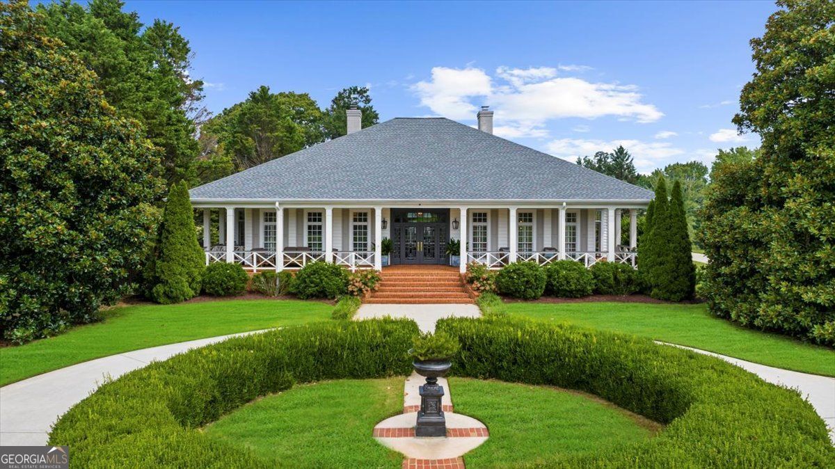 Luxury Estate on 11+ Acres with Pool & Guest House ! A private 11+ acre retreat offering luxury living, breathtaking panoramic views, and endless possibilities. Perfectly situated in the rolling hills of North Georgia, this beautifully maintained estate combines timeless elegance with modern updates for the ultimate home. The main residence showcases high-end finishes, spacious living and dining areas, and expansive windows framing serene views of the manicured grounds and sparkling pool. Step outside to enjoy your private oasis - with surrounding lounge areas, ideal for entertaining or quiet relaxation. A three-bedroom guest house provides exceptional accommodations for extended family, guests, or even a private office retreat. Whether hosting gatherings or enjoying peaceful evenings at home, this estate delivers unmatched versatility. The property's 11+ acres feature open green spaces, mature trees, and picturesque vistas that create a sense of tranquility while still being minutes from Gainesville conveniences, Lake Lanier, and easy access to Atlanta. This is more than a home - it's a lifestyle. Experience the beauty, privacy, and luxury of 4685 Nopone Road.