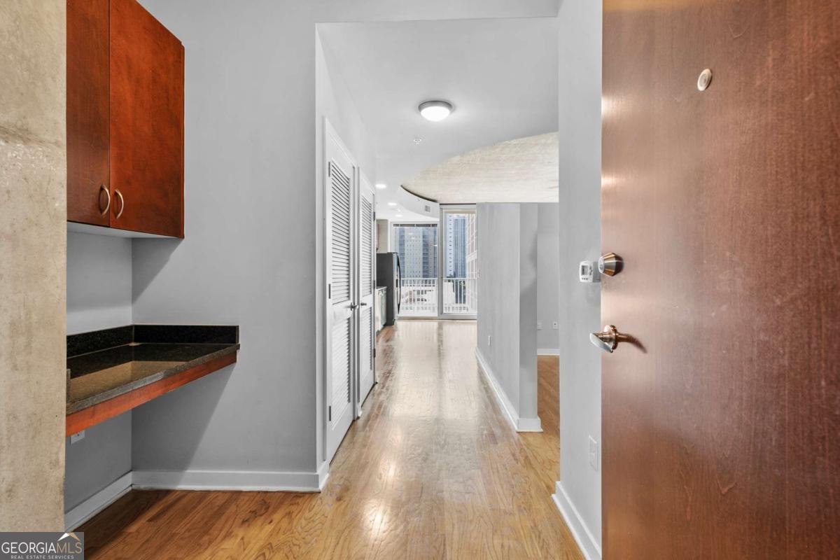 Downtown Atlanta 1-Bedroom Condo for Lease - Steps from MARTA, Parks & Attractions! Experience stylish Atlanta high-rise living at Twelve Centennial Park Condominiums, where this modern 1-bedroom, 1-bath rental blends comfort, convenience, and breathtaking views. Perfect for anyone searching for a condo for rent in Downtown Atlanta, this home places you at the center of the city's energy. Prime Location: Walk to Centennial Olympic Park, Georgia Aquarium, World of Coca-Cola, CNN Center, State Farm Arena, and a wide variety of restaurants, shops, and entertainment. The Civic Center MARTA Station is directly across the street, giving you car-free access to Midtown, Buckhead, Hartsfield-Jackson Airport, and beyond. Quick interstate access (I-75/85) makes commuting effortless. This location is ideal for those seeking a rental near MARTA or a downtown Atlanta apartment for lease. Condo Highlights: Enjoy floor-to-ceiling windows with spectacular south-facing skyline views, hardwood floors, high ceilings, and a private balcony perfect for sunsets. The spacious kitchen provides ample storage and counter space. A full-size washer and dryer are included. Luxury Amenities: Tenants enjoy a resort-style pool, fitness center, clubroom, on-site restaurant/bar, 24-hour concierge, security, and assigned parking-all included. This condo offers the perfect combination of affordable downtown living, modern amenities, and unbeatable walkability in Atlanta.