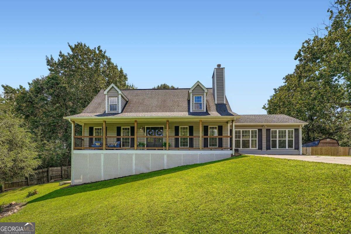 Beautifully Renovated Cape-Cod with Backyard Oasis in Canton, GA - Ideally located just minutes from I-575, shopping, and dining in Canton, this spacious 4-bedroom, 3.5-bathroom home offers versatile living across three thoughtfully designed levels. Step inside to discover a freshly painted interior that sets a bright and inviting tone throughout. The fully renovated kitchen is a showstopper, featuring an island, breakfast bar, KitchenAid appliances and generous dining space-perfect for entertaining and everyday living. A formal dining room provides additional hosting options for special occasions. The main-level primary suite is a true retreat with a walk-in closet and a completely updated spa-like bathroom, showcasing a dual vanity and a sleek glass-enclosed shower. Upstairs, two spacious secondary bedrooms share a full bath, while the lower level expands your living space with a fourth bedroom, full bath, recreation room, family room, and a dedicated office. Outside, your private backyard transforms into an entertainer's paradise. Enjoy the covered deck, enclosed above-ground pool, tiki hut bar, storage shed, and fenced yard-perfect for summer gatherings or relaxing weekends at home. This home masterfully blends modern updates, functional living, and outdoor fun-all in a prime Canton location. Discounted rate options and no lender fee future refinancing may be available for qualified buyers of this home.