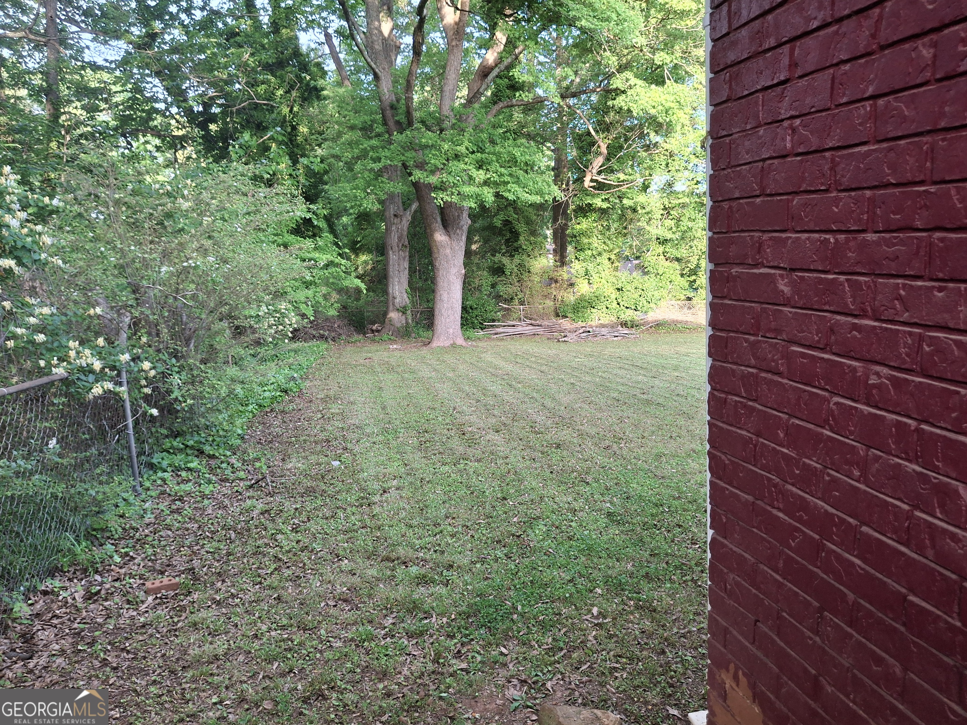 This 4-sides brick ranch home is in a quiet area near downtown Stone Mountain. Features 3 bedrooms and 1.5 bathrooms. Enjoy the open kitchen with an eat-in area and a view of the spacious den. Level driveway level with a huge, fenced backyard offering plenty of space for gardening, or just sitting out and relaxing or get-togethers. Friendly neighborhood, not far from downtown Stone Mountain with easy access to shops, dining, and other attractions. This home is vacant and ready for you to move in.