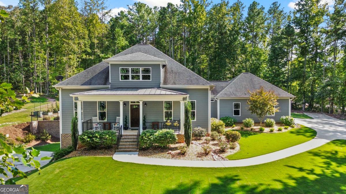 Elegant and Truly Immaculate! 2017 Built Craftsman Style Home on 4 Acres. Five Bedrooms, 3.5 Baths with Master on Main AND Full Finished Basement including Teen/In-Law Suite with Separate Driveway and Garage. The Long Driveway, Abundance of Privacy & Covered Rocking Chair Front Porch welcome you. Beautiful Hardwood Floors throughout Main Level. Gorgeous Kitchen featuring Granite Counters, Stainless Appliances & Tile Backsplash. A Large Center Island, Vent Hood & Pendant Lighting complete this Wonderful Entertaining Space. Open Concept Family Room Boasts Great Natural Light & Built-in Surround Sound that extends to Back Porch. Generous Primary Suite on Main Level with Large Walk-in Closet that includes Custom Closet System. Master Bath has Split Vanities, Oversized Tile Shower with Frameless Glass & Separate Water Closet. There is a Second Private Bedroom or Home Office on First Floor. Upstairs has HUGE Loft Area for Recreation, Gaming, etc. In addition, there are 2 More Bedrooms and a Full Bath. Upstairs also has Another Flex Room Perfect for Craft/Storage Room. The Custom Finished Basement will be the envy of all your friends. It has Amazing Natural Light and features a Full Kitchen with White Cabinets, Peninsula Island & Granite Counters. There is also a Family Room, Private Bedroom & an Updated Full Bath with Walk-in Shower. This Space includes a Private Driveway and Oversized Garage for Maximum Privacy. The Garage is Air Conditioned and has Ample Space for Gym, Workshop, etc. The Covered Back Porch walks out to a Fenced Backyard Oasis. This Space has an Amazing Pool with Walk-in Steps, Sitting Area and Diving Board. Flat Yard with Room to Play for Kids/Pets. You can warm up on Cool Fall Evenings by the Firepit or in the Hot Tub next to the Pool. 2017 Roof, HVACs & Water Heater. Hardwired High Speed Internet. 3 Car Garage with Insulated Doors. Extended Parking Area for an RV, Boat or Both. Just Minutes to Downtown Carrollton, Shopping, Dining, etc. This is TRULY a Must See!