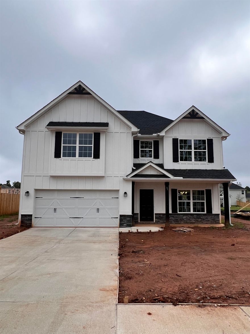 A Hughston Community. Welcome to our Delilah A Floorplan with 2406 SF of Elegant Living Space featuring Entry Foyer, Formal Dining Room, Spacious Kitchen, Large Great Room, 4 Bedrooms, 2.5 Baths with 2 Car Garage Our Signature Gameday Patio perfect for Outdoor Entertaining!           ***Ask About our Included Home Automation*** Top of the Line! You will be greeted with a Stunning 2 Story Foyer, Formal Dining Room, Spacious Great Room w/ Wood Burning Fireplace, Open Kitchen featuring Stylish Cabinetry, Granite Countertops, Tiled Backsplash & Stainless Appliances to include Gas Range. Large Kitchen Island overlooking Breakfast Area. Spacious Pantry for Additional Storage. Expansive Great Room Flooded with Natural Light featuring a Wood Burning Fireplace. Owner's Entry Boasts our Signature Drop Zone, the Perfect Family Catch All. Laundry & Half Bath conveniently tucked on Main Level. Upstairs leads to Huge Owner's Suite. Owner's Bath w/ Garden Tub, Separate Shower, His & Her Vanities & Generously Sized Walk-in Closet. Additional Bedrooms are Bright w/ Plenty of Closet Space. Enjoy Hardwood Flooring throughout Living Spaces on Main Level & Tons of Hughston Homes Included Features. Our Signature Gameday Patio with Wood Burning Fireplace creates your own Outdoor Oasis.