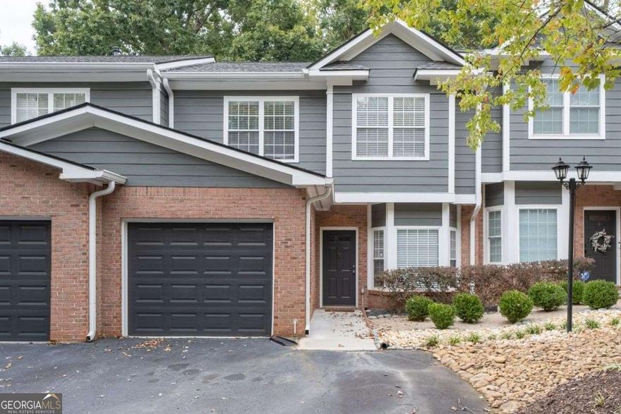Welcome to this stunning, gated 3BR/2.5BA, townhome, exceptional Location and well maintained, nestled in one of Atlanta's most well-kept and peaceful communities. Enjoy the best of both worlds, serene, quiet living with unbeatable convenience. This home is ideally located just minutes from major highways, lush parks, top-rated schools, popular restaurants, grocery stores, shopping malls, and entertainment. Step inside to a bright, open-concept white kitchen with granite countertops, a spacious breakfast bar, and stainless-steel appliances. The inviting living room flows effortlessly into a private patio and backyard-perfect for relaxing or entertaining. The master suite features a walk-in closet and a modern, bathroom. Two secondary bedrooms share a fully renovated bathroom, offering comfort and style for family or guests.  Wood flooring on the lower level. Additional highlights include a private garage and no rental restrictions, making this a rare find for homeowners and investors.