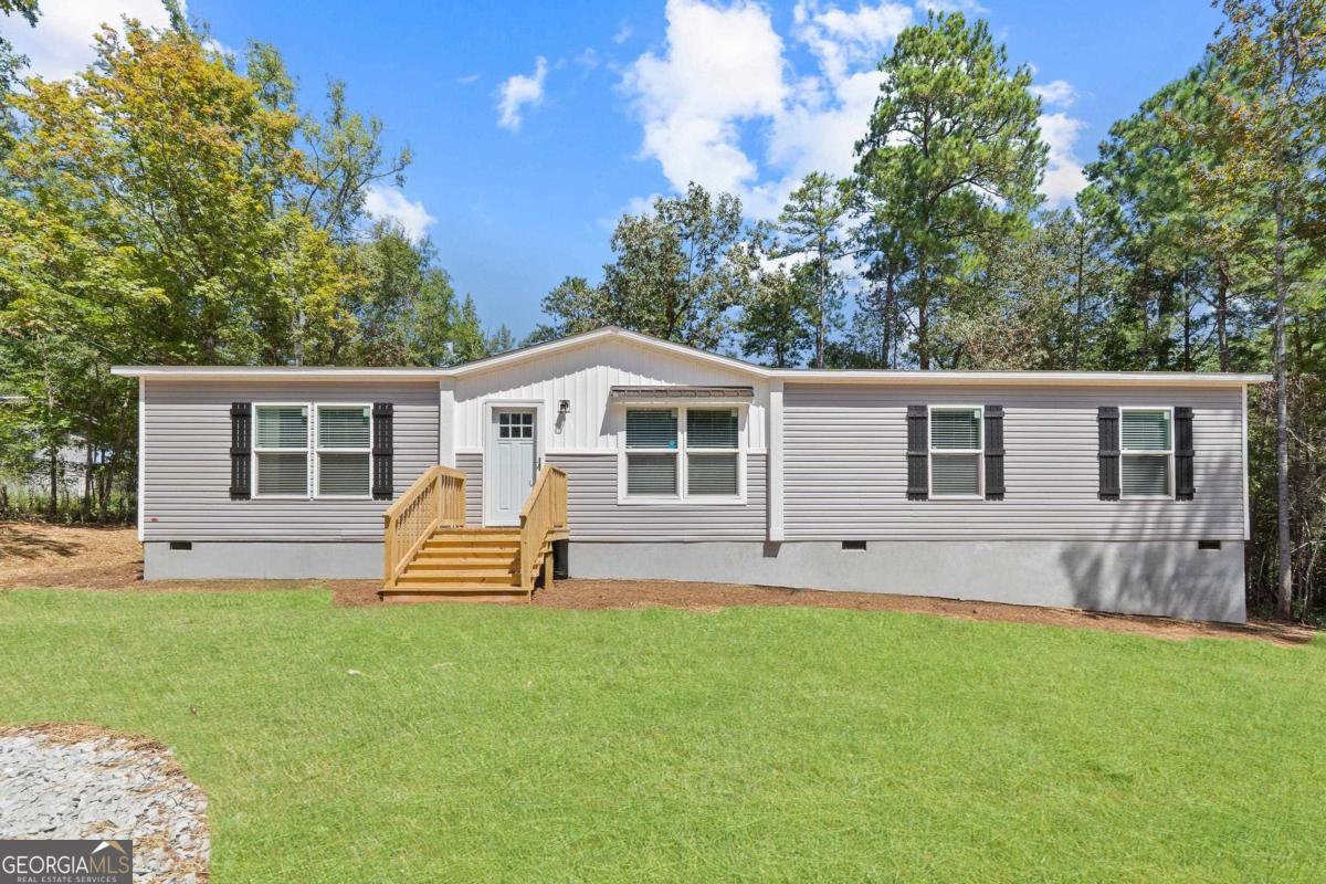 Beautiful brand new home located just a short stroll away from Twin Bridges Marina! All this home is waiting on is YOU! This home has all the upgrades you could want... Step inside and be greeted with an open floor plan - featuring a chef's kitchen (with a large island, an abundance of cabinetry, stainless steel appliances), a large living room with a built-in entertainment center with shelving and cabinets, and a dining area just to the side of the kitchen with sliding glass doors going to the HUGE back porch. Just off of the living room is the master suite - this features a large bedroom, walk-in closet, walk-in tile shower, double vanity and seperate soaking tub. On the other side of the home, you have two additional bedrooms that are generous in size with good size closets and a mudroom/laundry room that has a built in bench with hooks and shelving, washer/dryer hookup and counterspace with a sink and cabinets that is perfect for folding laundry! This home is perfect - just waiting on YOU! This property qualifies for both USDA (100%) financing and FHA financing & this home comes with a one year warranty - making this sweet deal even SWEETER! Call today & let's get you HOME!