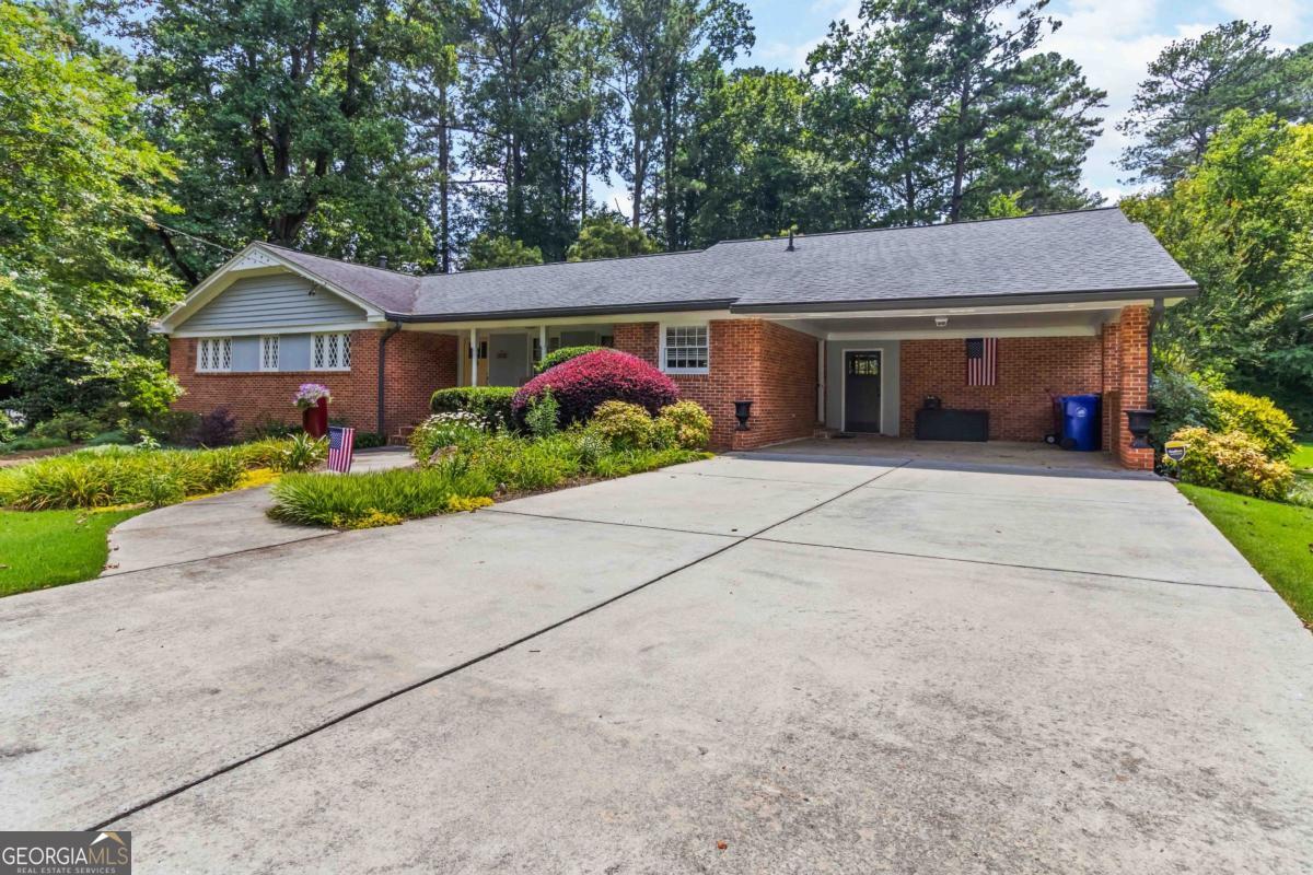 This beautifully maintained 3 bedroom, 3.5-bath brick ranch home features fully renovated bathrooms, offering modern style and convenience. Enjoy the bright and airy sunroom right off of the kitchen-perfect for relaxing or entertaining. Step outside to a spacious deck overlooking a serene, park-like backyard with a picturesque creek. A rare combination of updated interiors and peaceful outdoor living! NO SIGN IN THE YARD