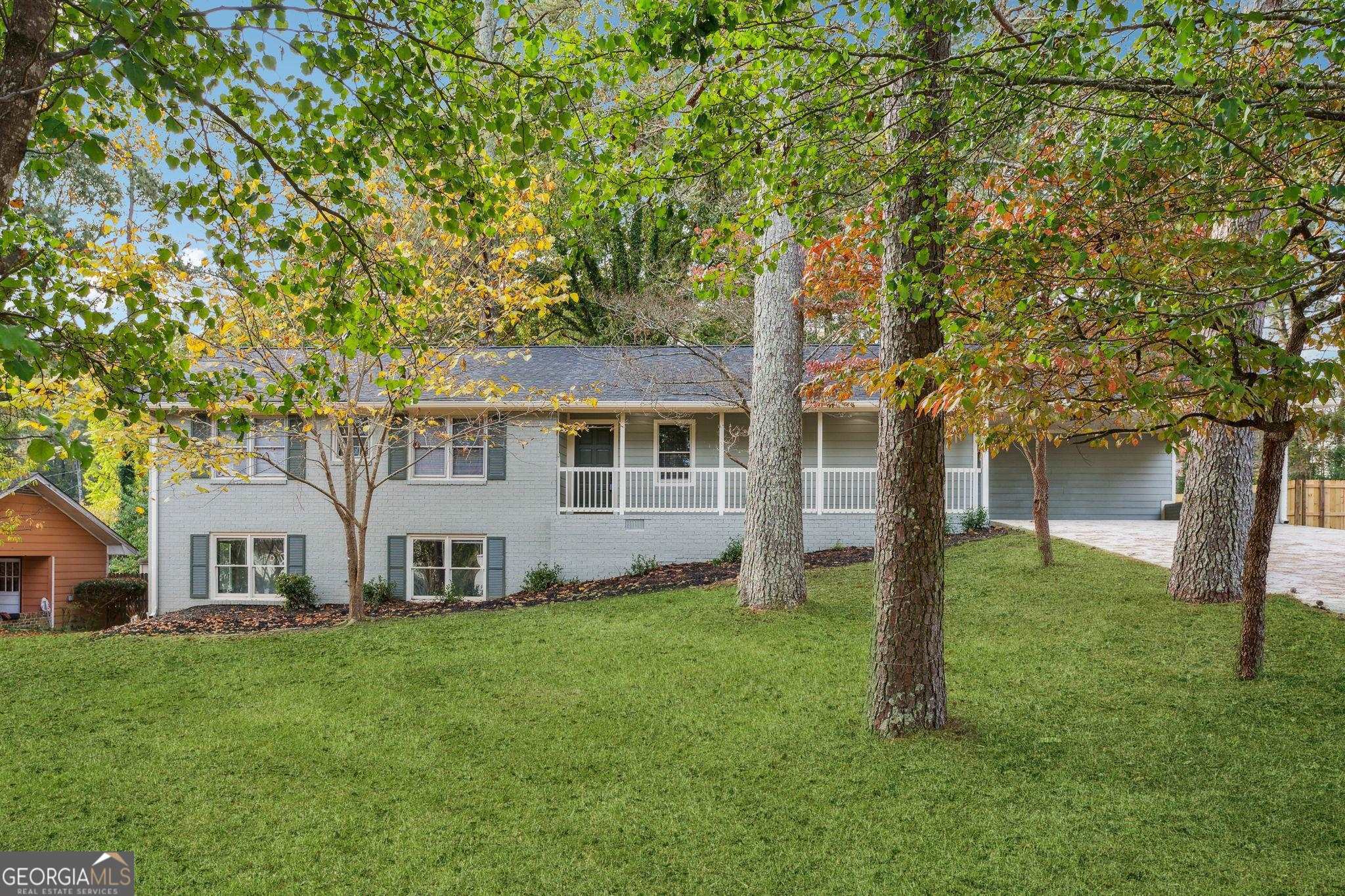 Absolutely gorgeous and UPDATED inside and out! You must view this home to appreciate the beauty. You'll find three bedrooms and two and a half baths on the main level of this ranch home, and a large bonus room in the basement (plus an unfinished room for storage). Sitting on one half acre, you have an almost level fenced in backyard with a new wooden deck ready for cool weather. An eat-in kitchen with bar seating opens into a long living room with a brick fireplace. Parking includes a two car brick carport attached to the home. The list of contractor updates include: -Fully updated Rehab -new HVAC system -all new plumbing lines inside home -new roof -Large finished room in basement with windows & exterior door. -Updated Kitchen - Quartz Countertops and all new Cabinets -new appliances stainless steel -all new flooring throughout -new Interior paint -all new exterior siding -new Deck in backyard -new exterior paint -all new plumbing fixtures -all new Sinks in Kitchen & Bathrooms -new quartz countertops in bathrooms - new tile showers -all new lights fixtures inside & outside home -all new outlets & switches throughout home -new mini blinds -Large unfinished storage room in basement Make an appointment today and let's put your LAST name on this FRONT door!