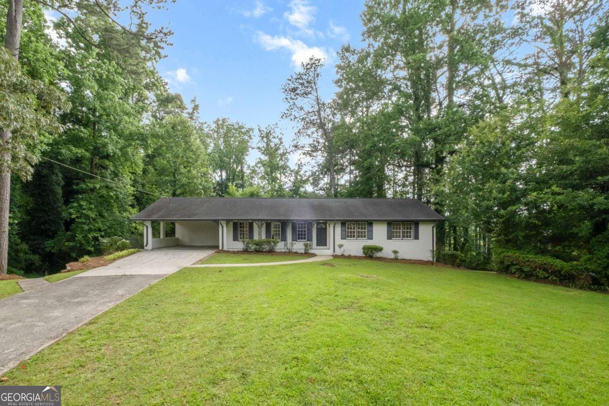 Stunningly renovated 4 bed/3 bath ranch home with finished basement offering an In-law suite with second kitchen! Home features brand new Luxury Vinyl Plank flooring, new interior and exterior paint, new lighting and plumbing fixtures everywhere, new cabinets, new granite countertops in kitchen and bathrooms, and new stainless-steel appliances. Enter into the large living room with fireplace and open views to the kitchen. Kitchen offers new granite, new cabinets, plenty of cabinets and countertops space, a large island with overhang for barstools, stainless steel appliances, and a large dining area. Master bedroom offers a walk in closet and En-suite with walk in shower, new granite and low flow toilet. Two good sized secondary bedrooms and secondary bathroom with tub/shower combo, low flow toilet, and new granite. The full finished basement offers a large second living room with fireplace, full kitchen with new granite and new granite, second laundry area, full bedroom and full bathroom with walk-in shower. Out back the large patio overlooks the massive backyard with storage shed.