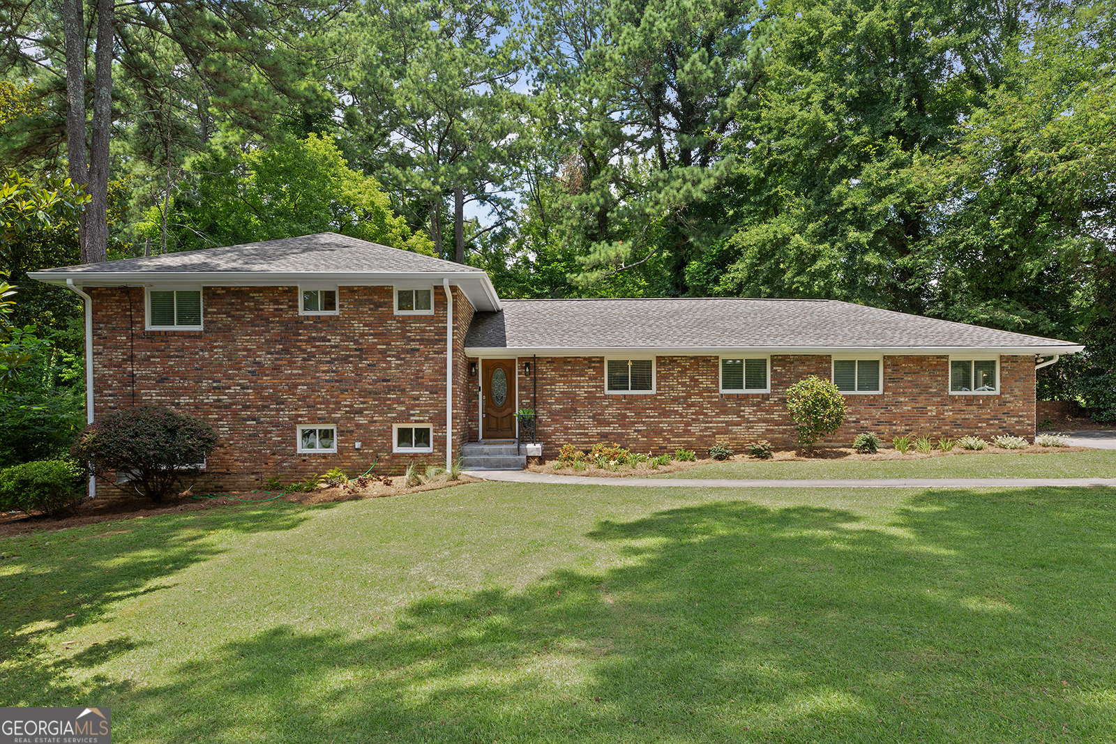 Charming Split-Level in Briarcliff with Spacious Yard and In-Law Suite Potential. Located in the sought-after Briarcliff area, this beautifully maintained 4-bedroom, 3-bath split-level home offers a versatile layout and a generously sized yard perfect for outdoor living. The main level features an inviting living room filled with natural light, a dedicated dining area, and a well-appointed kitchen ready for your personal touch. Upstairs, you'll find three spacious bedrooms and two full bathrooms, including a primary suite with ample closet space. The lower level offers a private fourth bedroom and full bath - ideal for guests, a teen suite, home office, or in-law setup - along with a spacious second living area and den. Step outside to enjoy the expansive backyard, perfect for entertaining, gardening, or play. The lot offers plenty of room to add a pool, deck, or simply relax under mature trees. Conveniently located near Emory, CDC, top-rated schools, shopping, and dining, this home is a rare opportunity in a quiet, established neighborhood. Don't miss your chance to put down roots in one of Atlanta's most beloved communities!