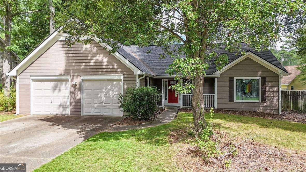 Welcome to this beautiful and spacious ranch home located in the heart of Powder Springs. Step inside to a massive living room with soaring vaulted ceilings that fill the space with an abundance of natural light, creating a warm and inviting atmosphere. The large kitchen is perfect for cooking and entertaining, featuring stylish gray cabinets, granite countertops, and stainless steel appliances. The owner's suite is a true retreat with a walk-in closet and a recently renovated ensuite bathroom complete with double vanities, a separate soaking tub, and a walk-in shower. Two additional generously sized bedrooms and a second full bathroom offer plenty of space for family or guests. Step outside to the brand-new deck, ideal for relaxing afternoons or weekend gatherings in the private backyard. Don't miss this wonderful opportunity to own a thoughtfully updated home in a fantastic location-schedule your showing today!