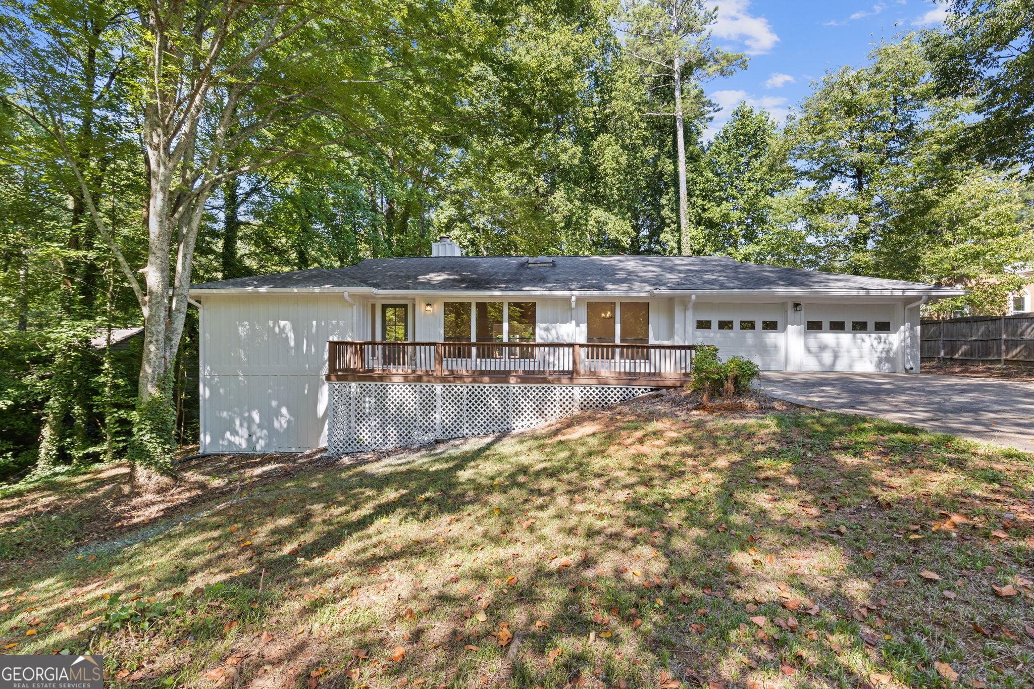 Graciously updated ranch home with custom finishes, on a fully finished basement and brand NEW 5 ton HVAC. The main level has three bedrooms, two full bathrooms, and a half bath, while the basement has a Jack and Jill and a large bonus room. Make your way across the oversized front porch to the new front door. As you enter onto the 5 inch Natural Acacia Engineered Hardwood flooring, you immediately notice the vaulted beamed ceilings and skylight, accented by a sizable cooling fan. In this space is the open concept dining room, with views to the living room. A marble gas fireplace is the focal point here, which one can also view from the sprawling kitchen area. If the dining room is too formal, have a bite at the bar area of the expansive island. Equipped with double ovens, an electric range, ample storage, and quartz countertops, your kitchen is a chef's sanctuary. Exit from the laundry, living room, or master onto the sweeping back deck that spans almost the length of the home. From here one can see the pond past your three quarter acre plot. Impressive marble tile in every bathroom, and ample counter space in your two Jack and Jills. In addition to the beds and bath in the basement is a long bonus room, which leads outside to a patio. A list of contractor updates include: new 5 ton HVAC, front door, fresh interior and exterior paint, kitchen quartz countertops and ss appliances, all new light fixtures and fans, new flooring and base trim, new vanities in bath (everything in bathrooms is new), breaker box, outlet and switch covers, painted garage and basement storage floor, deck newly painted, all new interior doors, and new blinds. Make an appointment today and let's put your LAST name on this FRONT door!