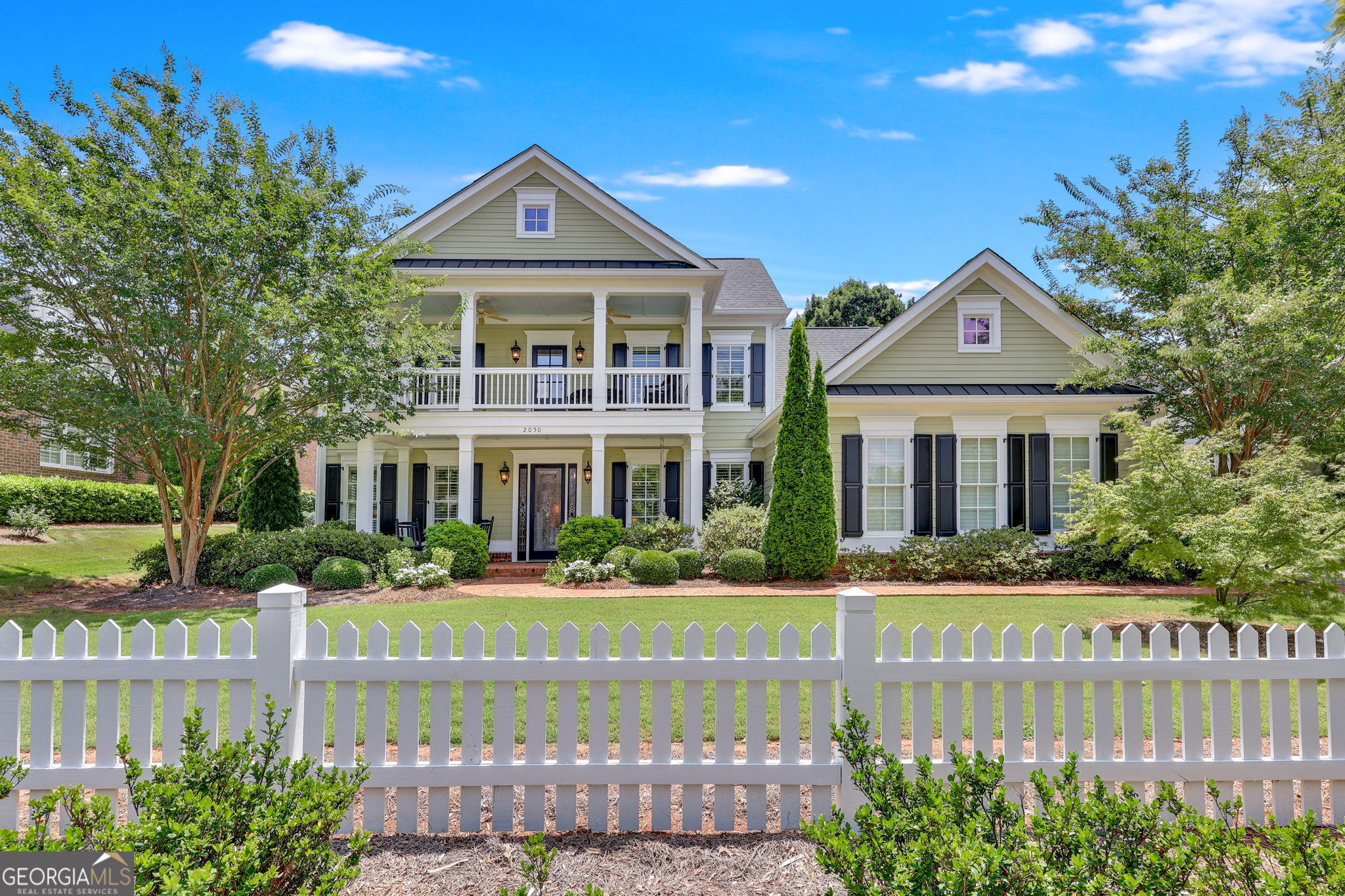 A FANTASTIC OPPORTUNITY for the avid golfer or anyone who appreciates a beautiful home and lifestyle!! This amazing estate, golf course home is now available inside The Georgia Club! The Georgia Club is a gated, 27-hole golf course community, with a relaxed country club lifestyle, located 10 miles east of the Athens, Georgia City limits. This stunning beauty was designed and decorated by a well-known Atlanta Interior Designer and features panoramic views of #7 Silver of the Chancellor's Course. The fenced backyard and gardens offer a serene oasis for relaxing beside a bubbling fountain and are shaded by huge trees, multiple smaller trees, shrubs, and flowers. Enjoy the golf course views and the incredible, unexpected privacy of the home from the grand, skylighted back porch. The floor plan is open-concept but with welcome deviations from the typical, open-concept house plans available in today's market. This home also features 2 bedrooms, 2.5 baths and a separate office on the main level. The formal dining room was creatively designed with hand-painted walls by a professional artist and is open to a spacious great room with built-ins and a fireplace. The magnificent, gourmet kitchen creates a beautiful focal point with its huge Quartz island, large farmhouse sink, French Country lighting, designer backsplash, and custom-designed cabinetry. An oversized walk-in pantry provides abundant storage for small appliances and food items. A "sunny" breakfast room is a beautiful complement to the inviting kitchen and is simply stunning! The main level primary suite is flooded with natural light from multiple windows and has French door access to the grand, skylighted back porch. A spacious spa-like bath, with separate soaking tub and zero-entry glass shower, adjoin the amazing walk-in closet that will "WOW" you with its abundant space and design. A well-designed home office is conveniently located on the main level near the primary suite. A second main level bedroom and bath, with exterior access, are located on the opposite side of the home and offer private guest space or a convenient work-out space. Overnight visitors will feel welcome and enjoy privacy in the two upper-level bedrooms, each with a private bath, a TV/sitting room area, and serene park/garden views from the upper-level balcony/porch. Three garages provide adequate parking for cars and golf carts, while guest parking is easily accommodated on the extensive driveway of the home.