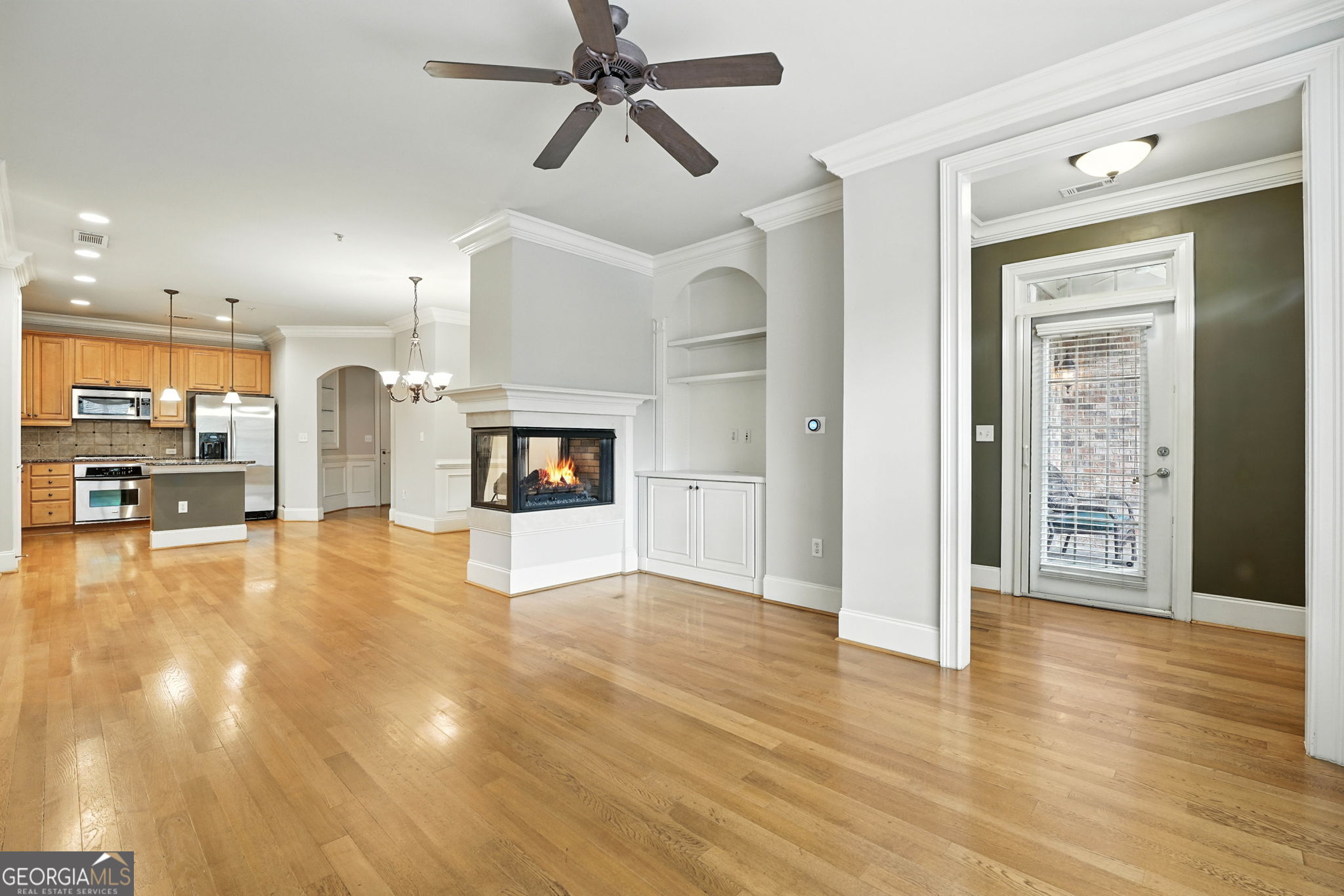 Meticulously maintained and freshly painted, this condo boasts soaring 10+ ft ceilings, an open floor plan and the perfect size for comfortable living. The kitchen features granite countertops, while hardwood flooring flows throughout the unit with tile in the bathrooms. The living area includes a cozy 3-sided fireplace and built in entertainment center. Each bedroom offers a spacious walk-in closet, including a custom-built system in the master for added organization and storage. The master suite also features a spacious bathroom with a separate tub and shower. Enjoy the convenience of interior stepless entry via spacious elevator from the covered garage, in addition to the exterior entry access directly to the unit. A storage unit is also provided accessed through the parking garage. A spacious front porch is perfect for outdoor seating and relaxation. Community amenities include a resort-style pool, outdoor fireplace and grills, clubhouse, fitness center, community garden, and plenty of guest parking. HVAC recently serviced and in good working order. Seller providing 1 year home warranty.Located in a gated community near Brook Run Park, Dunwoody Village, Perimeter Mall, and endless shopping and dining, with easy access to I-285 and GA-400. A fantastic opportunity to enjoy comfort, convenience, and amenities all in one!