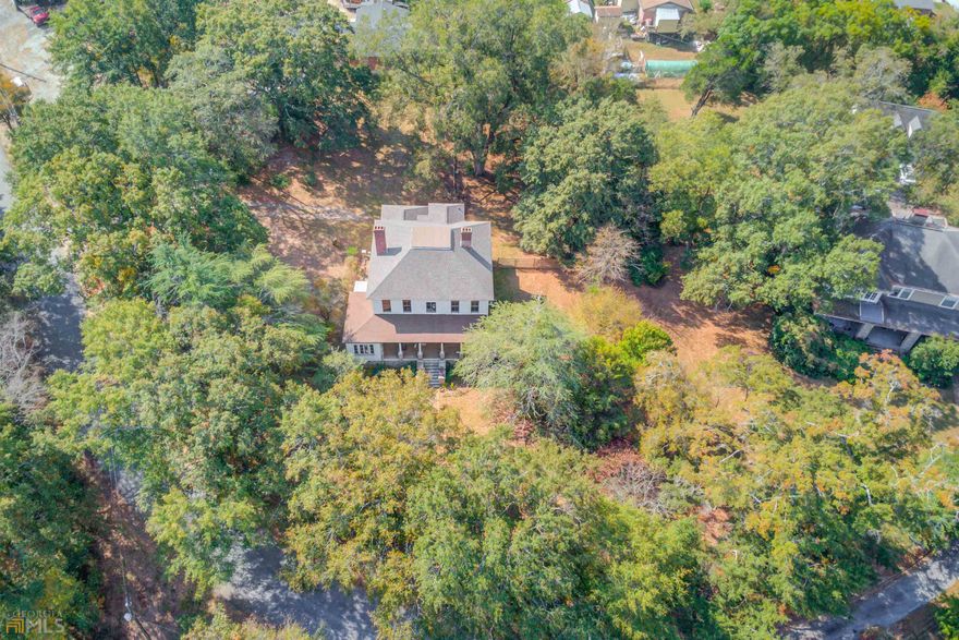 SHINE ON YOU UNIQUE DIAMOND! Amazing opportunity to live on one of the best streets in Millstead! This timeless 1900 Farmhouse offers the best of both worlds - every bit of classic charm while effectively utilizing every inch of the original footprint. This 4 bed, 2 bath, has plenty of living space, high ceilings throughout, large rooms, large living/dining room, and oversized master suite with a sitting area. The upstairs also features a landing area that would make a perfect office/workout/flex space. Beautiful stone foundation, wavy glass windows, several fireplaces, and too many architectural features to list. Near downtown Conyers, across the road from Yellow River! Come and put your finishing touches on this masterpiece and make your own. Cash or Conventional financing only. This home is priced to sell FAST and will not last long. SOLD AS IS.