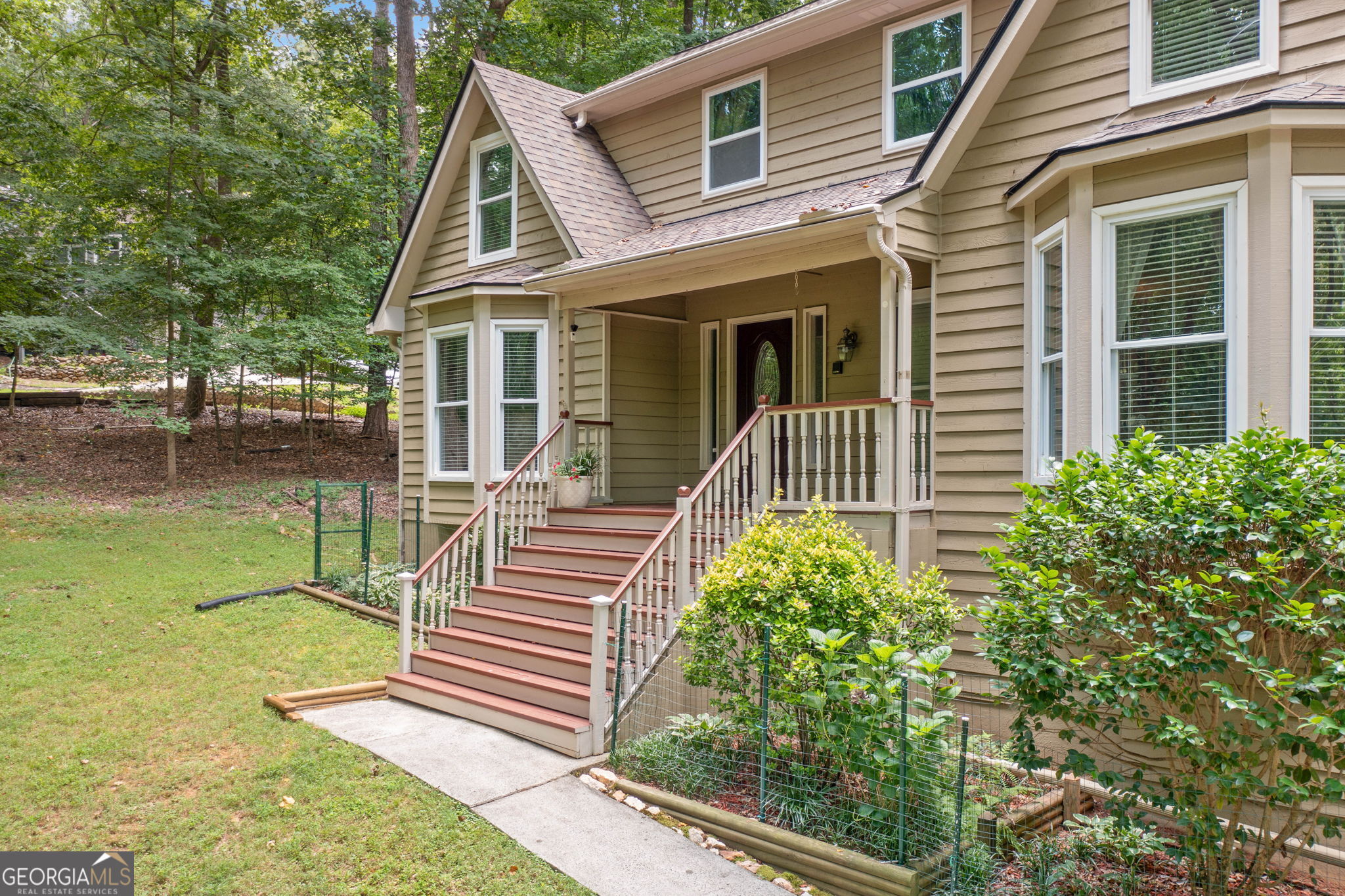 Private Retreat minutes from downtown Woodstock - 4BR, 3.5BA on 1.1 Acres Tucked away on a beautifully wooded 1.1-acre lot, this meticulously maintained home offers the perfect blend of nature, comfort, and convenience. With two spacious primary suites-one on the main level and another upstairs-this home is ideal for multi-generational living or flexible guest accommodations. Step inside and feel right at home in the warm, inviting living spaces. Enjoy your morning coffee or unwind in the evening from the serenity of your screened-in sunroom or beautiful back deck, both overlooking peaceful, tree-filled surroundings. A brand-new roof and careful upkeep throughout make this home truly move-in ready. Love to work from home? You'll find dedicated office space ready to inspire productivity. Need a workshop? We've got that too-perfect for hobbies, storage, or creative projects. Located just minutes from vibrant Woodstock, you'll enjoy quick access to top-rated schools, shopping, dining, and Lake Allatoona for weekend escapes. An adjacent 1.1-acre lot is also available, offering a rare opportunity to expand or preserve your own private sanctuary full of natural beauty and local wildlife. This is more than a house-it's a lifestyle. Schedule your private tour today and discover all this special property has to offer.