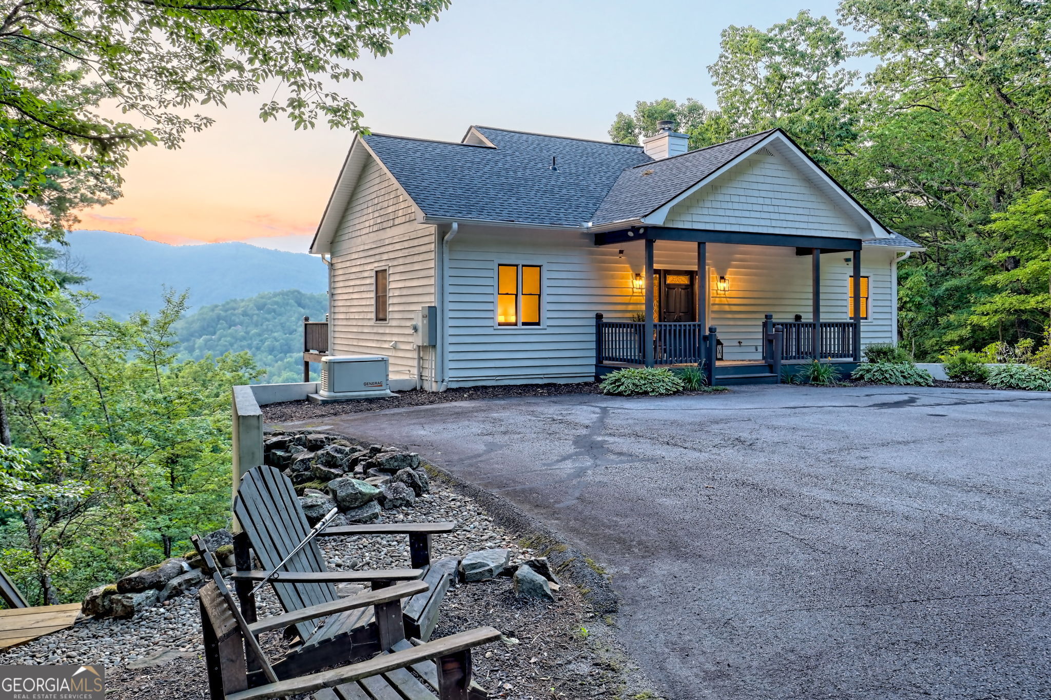 Photography/drone/3D coming soon. Now's your chance to own a wonderful 3/2.5 on Screamer Mountain with year round mountain views. Use as a primary residence or vacation home with rental potential. Lower on the mountain with all paved road access this 2003 home has many recent updates and is very close to town, yet has lots of privacy on a small dead end road with excellent neighbors. Enjoy the N/NW mountain views year round from any of the interior rooms or back decks, including the screened room off the family room. Grill out, and relax while taking in an iconic view of the Rabun Cross. 9' ceilings throughout with new appliances, primary on the main, new LVP flooring on the entire upper level, and a deck that spans the entire width of the rear of the home and is accessible via 3 interior doors. Grilling area, screened room, and lounging deck off the primary bedroom. Downstairs you'll find another full length deck and the daylight basement has a stand alone heater/stove, bar, game area, two bedrooms, bath and storage. Whole home generator, 750 gallon propane tank, fresh paint, new roof, new retaining wall, and of course the long staircase down into the woods where you can enjoy the intermittent stream. Seller loves the place, but a new job necessitates the move. No HOA or restrictive covenants.