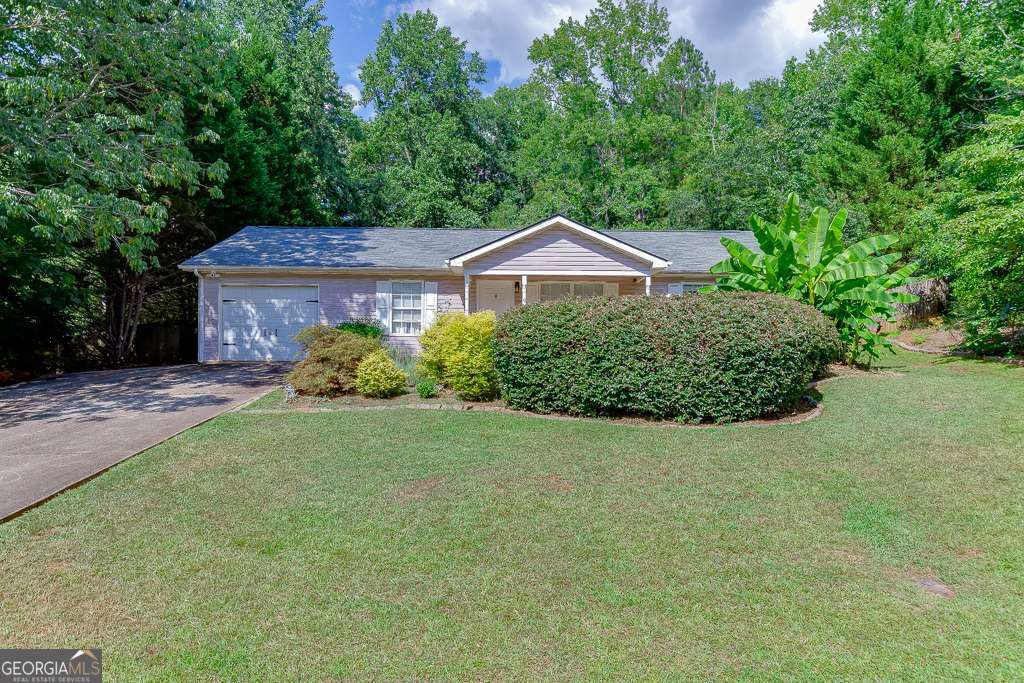 Welcome to 6784 Creeks Edge Court, a charming 3 bedroom, 2 bathroom ranch nestled on a peaceful cul-de-sac lot in the heart of Flowery Branch! This delightful home offers a perfect blend of comfort and style with thoughtful updates throughout. Step inside to discover beautiful designer paint colors that complement the newly updated flooring, creating a fresh and inviting atmosphere. The open-concept kitchen and living area feature ample cabinet space and a breakfast bar, ideal for casual dining and entertaining. Relax in the spacious primary suite complete with a private ensuite bath, while two additional bedrooms offer flexibility for family, guests, or a home office setup. Enjoy the outdoors from your oversized, covered back patio overlooking a large, private and fenced backyard with mature trees - perfect for morning coffee, weekend barbecues, or simply unwinding in your own retreat. Situated in a friendly neighborhood with easy access to shopping, dining, and top-rated schools, this move-in-ready home offers unbeatable value and location. Don't miss your chance to make this inviting property your next home - schedule your private showing today!