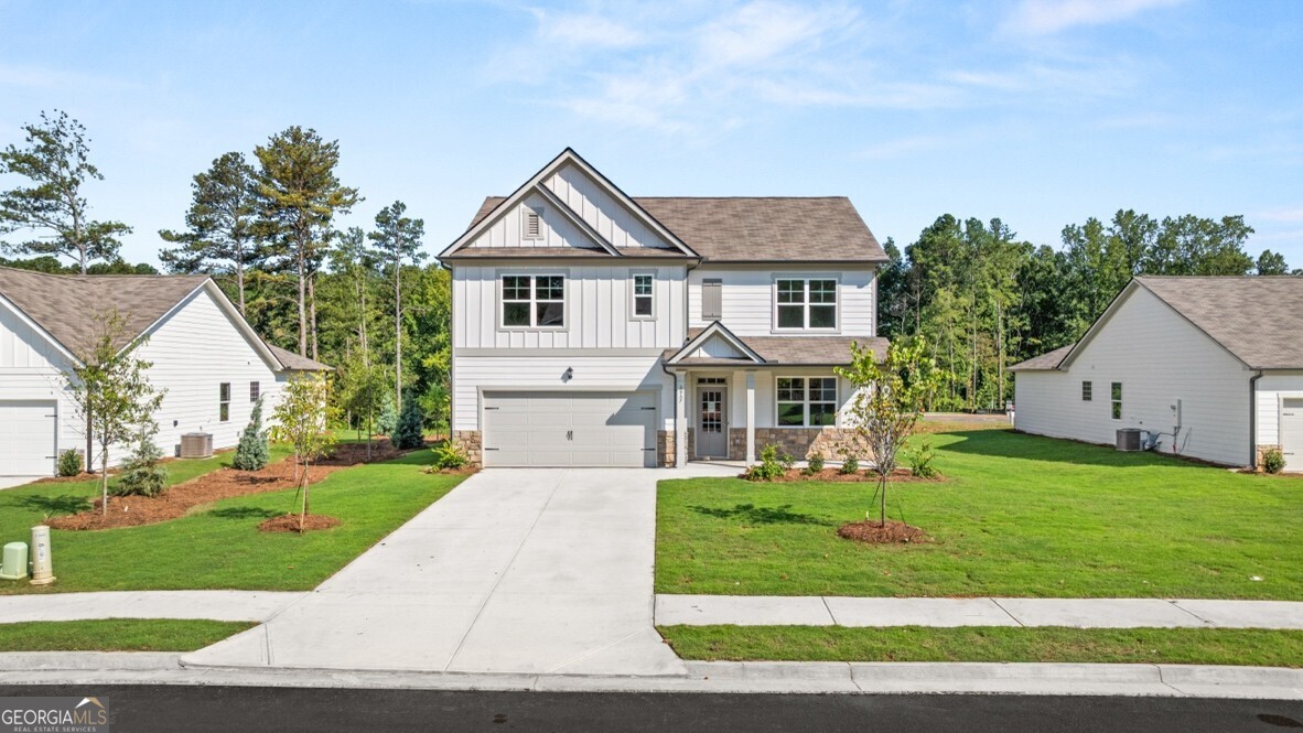 Welcome to 3957 Fairhaven Road ready to move in new construction home at Fairhaven in the city of Lithia Springs, GA. This Hayden floor plan offers 5 bedrooms and three bathrooms in its 2,511 square feet. Flex room inside front door--the perfect space to customize for your family needs--dining room, study or play room. Spacious kitchen stuns with its large granite center island, walk-in pantry, stainless-steel appliances and attached dining area. The adjacent living room is the ideal space to gather with loved ones or relax after a long day of work. Convenient bedroom and full bathroom round out the main level, great for guests or in-laws. Spacious primary suite and en suite bathroom with double vanity, separate tub and shower, water closet and large walk-in closet. Second floor living room is centrally located between three additional bedrooms, the third bathroom, laundry room, two linen closets and a storage closet off of the loft area. Come tour your new home today at 3957 Fairhaven Road.