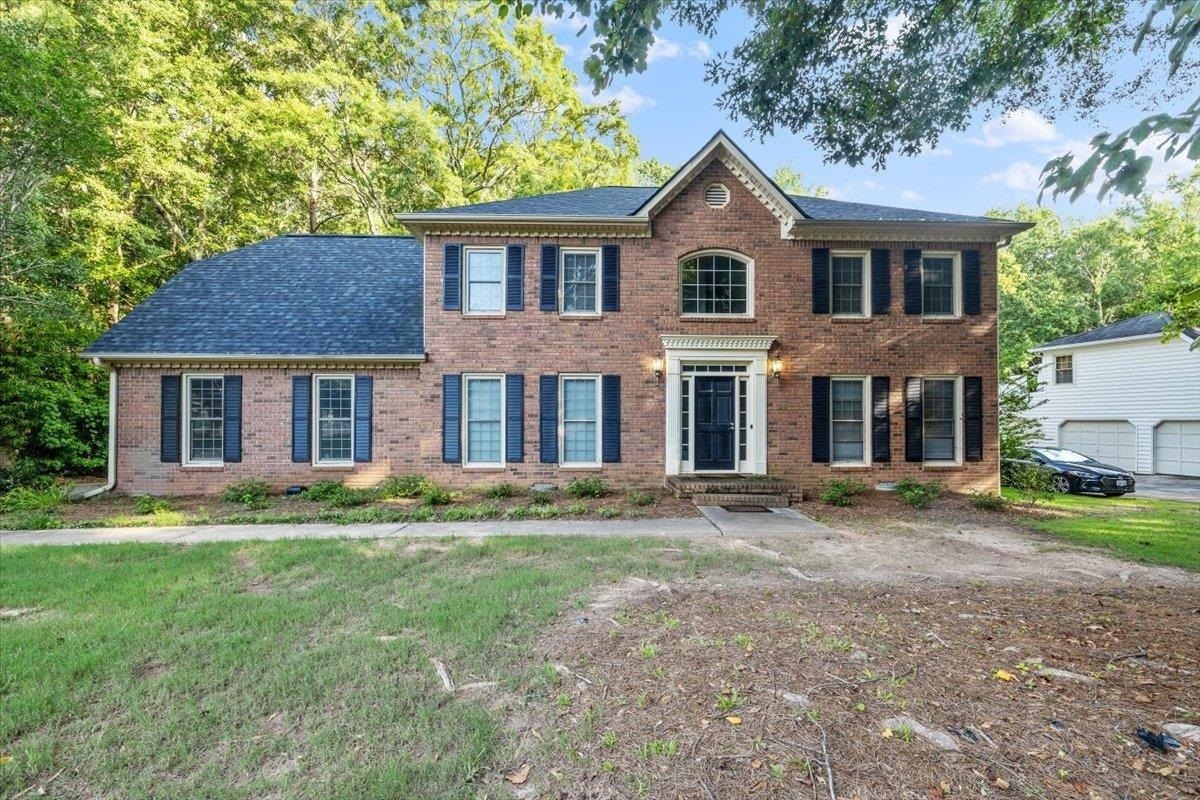 Welcome to your dream home in The Coventry! Located in one of Peachtree City's most desirable neighborhoods, this beautifully updated John Weiland home features five spacious bedrooms and two and a half baths. Enjoy access to community amenities including a pool, playground, and tennis courts, all within the highly acclaimed McIntosh School District. Inside, you'll find a bright and expansive first floor with a large living room showcasing custom carpentry, a gourmet kitchen with granite countertops, stainless steel appliances, and a center island. There's also a separate dining room and an additional flex space perfect for an office or second living area. A private entrance through the garage leads to a generous fifth bedroom or teen suite upstairs, offering privacy and flexibility. The second floor is carpeted throughout and includes a luxurious owner's suite with an oversized eight-foot custom shower, three additional bedrooms, and the spacious teen suite with its own entrance. Step outside to a large deck overlooking a fenced-in backyard-ideal for entertaining or relaxing. Recent updates include a new roof in 2023, a water heater replaced in 2020, and new flooring, cabinets, and vanities throughout the home.