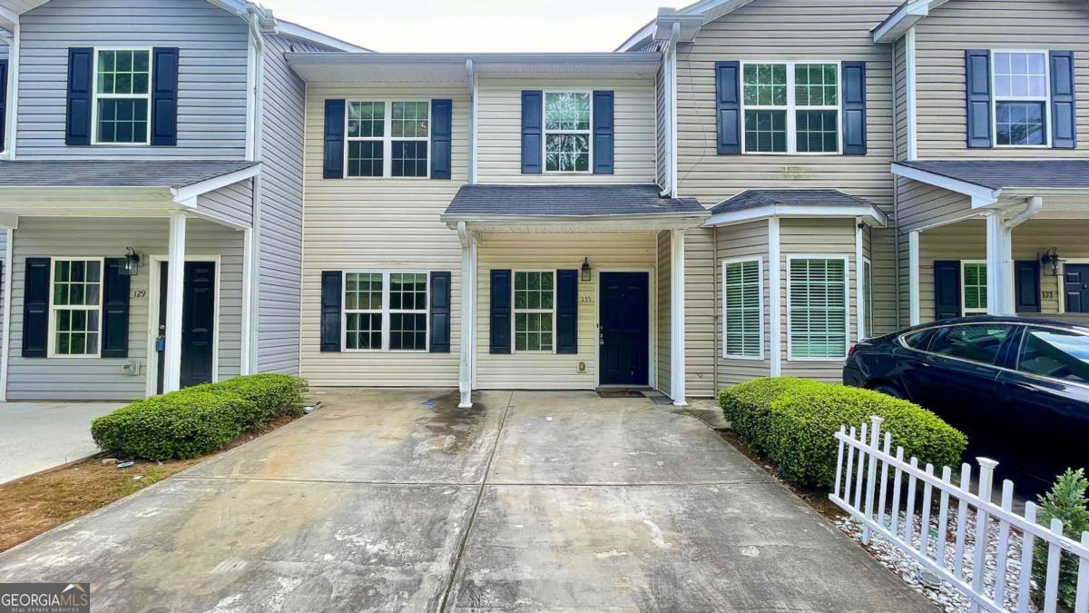 Spacious 3BR/2.5BA Townhome in the Heart of Hiram! Tucked away in a quiet, well-maintained community just minutes from Downtown Hiram, this roomy townhome offers comfort and convenience in an ideal location. Step inside from the welcoming front porch stoop into a large, open-concept living and dining area that flows seamlessly into a bright kitchen featuring stained wood cabinetry, a walk-in pantry, generous breakfast bar, LVP flooring, and included black/stainless steel appliances (range, dishwasher, and microwave) along with a small private patio in the back, perfect for a grill and a couple of chairs. Upstairs, you'll find a spacious primary suite with an en suite bathroom, two additional bedrooms, a second full bath, and a laundry closet for added convenience. Parking is a breeze with a dedicated 2-car parking pad right out front. This home is perfectly situated near local dining, shopping, and groceries-including Walmart-and offers easy access to everything downtown Hiram has to offer. Simple application process. yard maintenance, trash, water included. Contact us today for more details or to schedule a showing!