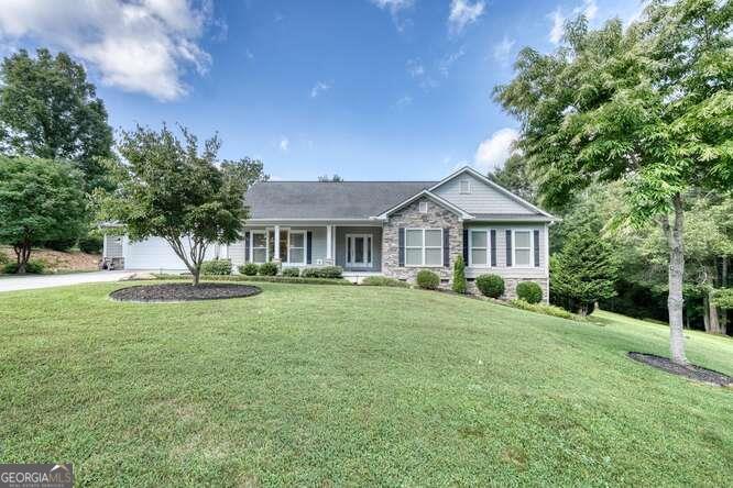 Wow! Check out this immaculate home in the sought after community of Owen Glen. This pristine home boasts one level living with 3 BR/2 Bath and an open floor plan. There are 2 spacious living room areas for your enjoyment and entertaining. Vaulted ceilings with skylights and windows galore let in the magnificent sunlight. The two upgraded enclosed porch areas provide wonderful spaces for your relaxation. There is a large primary suite with huge walk-in closet and beautiful ensuite bathroom with an extra-large glass block walk-in shower. The kitchen is open to one of the living areas and has granite counter tops and updated appliances. Two additional bedrooms and a full bath compliment this floor plan for guests or extended family. Large laundry room is located off the kitchen, also with an entrance from the oversized garage. This residence also comes complete with whole house generator. You will love the beautiful 1.56-acre lot with a creek and manicured landscaping. Additional amenities include golf course, swimming pool, tennis/pickleball courts and a gorgeous clubhouse. This home is a JEWEL...don't miss this one.