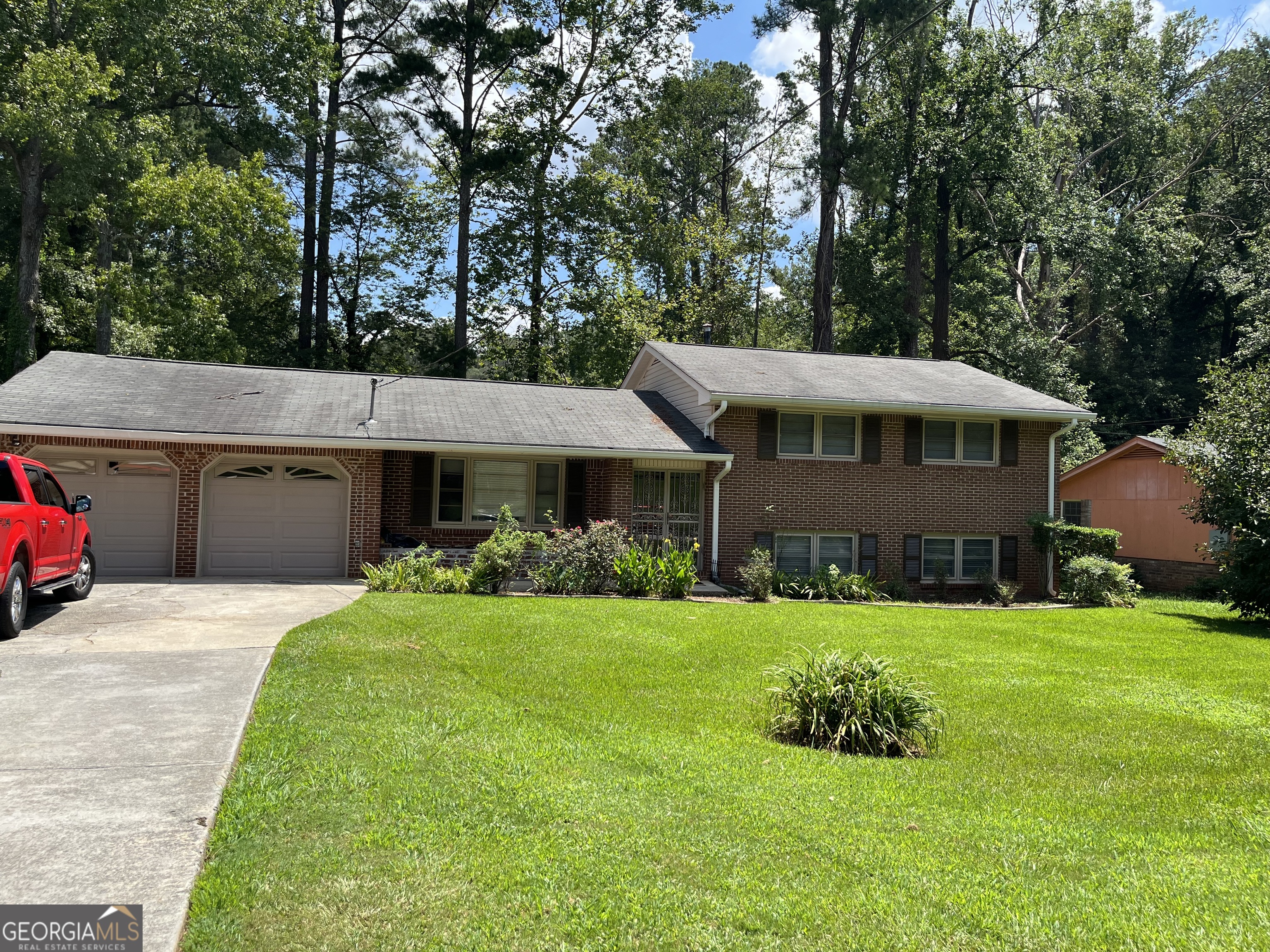 Welcome to 4050 Welcome All Terrace - solid 4-sided brick home in a well-established, desirable South Fulton neighborhood, less than 10 mins from Atlanta Airport. This 4 bed, 3 bath home sits on 0.396 acres and offers great space with a partial basement and a garage conversion that adds a bonus bedroom and full bath. Over the years, the seller has made key updates including HVAC, exterior plumbing, and added a sunroom for extra living space. The open, level backyard has plush grass-perfect for relaxing or entertaining. With area comps over $280K, this home is ideal for owner-occupants with instant equity or investor-friendly. Great opportunity!