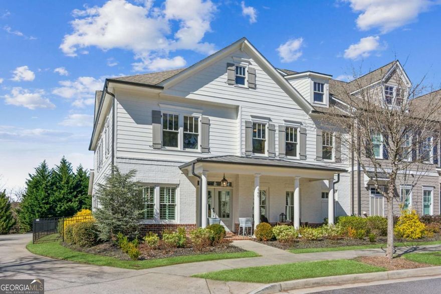 Welcome to 560 Parkview Drive, an exquisite 4-bedroom, 3.5-bath home in Milton, GA, offering a luxurious lifestyle with thoughtful renovations and custom trim work throughout. Located within a two-minute walk to the vibrant Crabapple Market District, with its restaurants, shops, events, and entertainment, this home enjoys an unbeatable location, highly ranked schools, and an array of desirable features. The master suite, conveniently located on the main level, serves as a true sanctuary featuring a freestanding soaker tub, an oversized shower, dual vanities, and three walk-in closets outfitted with custom built-in cabinetry. Exquisite details abound with crown molding, a mixture of both board and batten and tongue and groove trim work and hardwood floors and plantation shutters throughout the main level. Additionally, the main level boasts an intimate dining room and powder room. The open kitchen concept includes white cabinets features, a breakfast bar and an oversized Quartzite island. Top-of-the-line Thermador professional appliances including a gas cooktop and double ovens complete this dream kitchen. The open-concept connects the kitchen to the family room with a coffered ceiling and white washed brick gas fireplace creating a perfect place for gatherings and relaxation. Outside features a newly landscaped yard with charming covered front and rear porches perfect for entertaining or playing with your pet in the fenced backyard with doggie pickets. Upstairs, privacy, productivity, and fun blend effortlessly in this home, with dedicated spaces for everyone. The open recreational area features a pool table, custom bar with custom reclaimed wood countertop, and a beverage refrigerator for your favorite game day entertainment. A flex space that can serve as a workout retreat or that extra storage you may need, an additional ensuite bedroom, and two bedrooms with a shared Jack-and-Jill bath and laundry room complete the upper level. The garage rounds out this move-in ready home. Outside, sidewalks lead to all parts of Crabapple, allowing for convenient walks to restaurants and shopping, while enabling you to relish the beauty of Historic Crabapple. Just steps away, you'll find Six Bridges Brewing, The Nest Cafe, a variety of restaurants, fitness centers, a seasonal farmers market, specialty food & wine, and live entertainment on the weekends. With spacious rooms, elegant finishes, and a prime location, this home is a true gem.