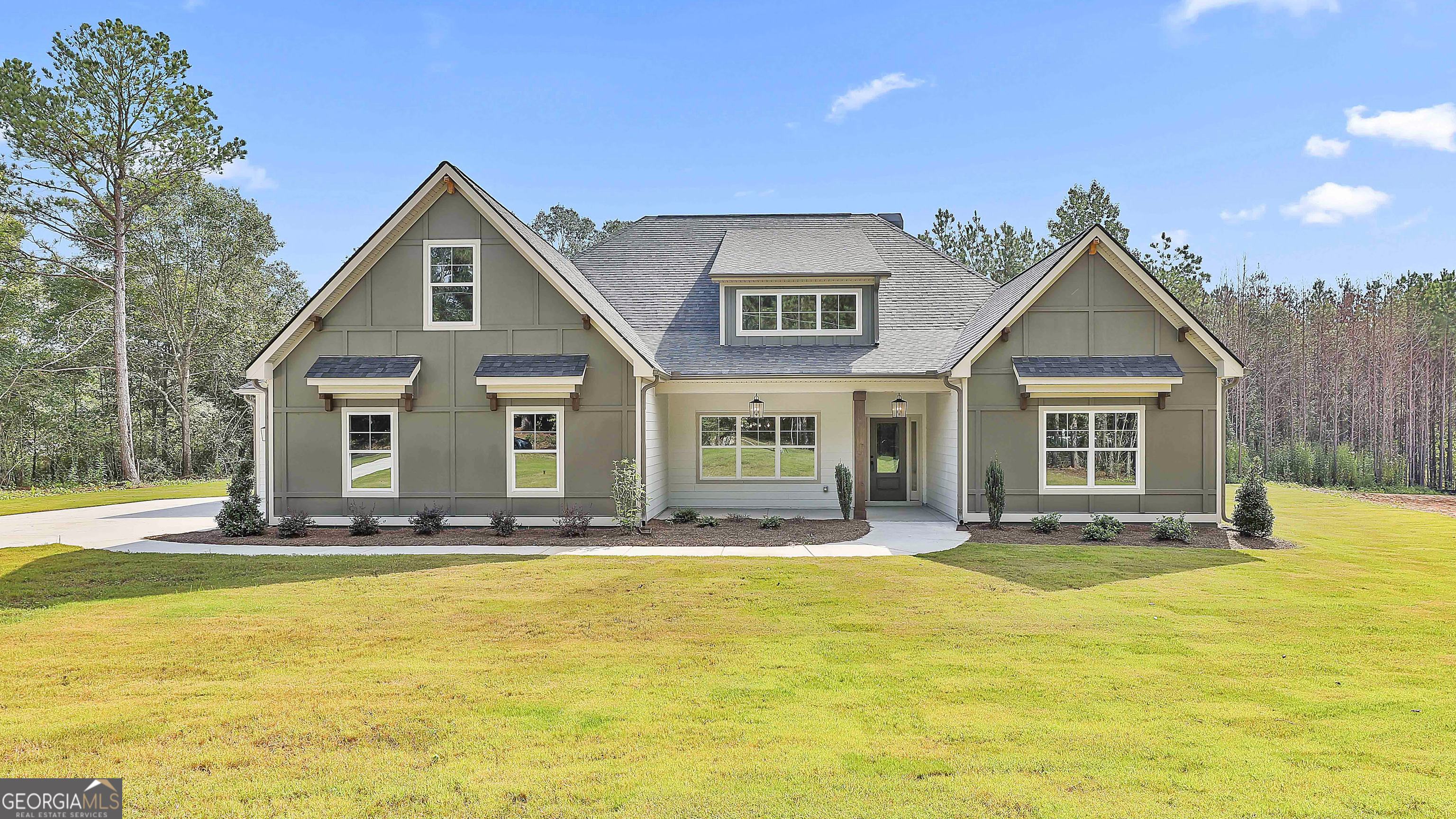 Harris A - The Harris is a new Ranch floor plan that you don't want to miss! This "A" Elevation has cottage charm that immediately invites you in. An office/living room with French doors is right off the front entrance. The gorgeous kitchen has toffee cabinets, stainless steel appliances, double wall ovens, a custom wood hood vent, and pull out trash can. Beautiful quartz countertops, a farmhouse sink, and a huge walk-in hidden pantry. A separate butler's pantry/coffee bar offers additional cabinetry and countertop area. This kitchen has everything! The peninsula allows for an eat in area in the family room/ breakfast room combo. Behind the sliding barn doors is the master oasis. Vaulted ceilings in the master bedroom, an ensuite with double vanities, freestanding tub, and beautiful shower with a bench. The bathroom connects to the master closet which is then connected to the laundry room! The flow in this home is amazing. On the opposite side of the master, there are three additional bedrooms and two additional full baths. On the expanded covered patio there is a woodburning fireplace, to sit and enjoy the expansive woods behind your home. A three car garage, on a 2.144 acre lot. This house has it all! This home is currently under construction - cabinets and countertops are installed! More photos coming soon! ***BUYER INCENTIVE: $25,000 to use towards closing costs, rate buy down, or price reduction, when working with a preferred lender and closing in 45 days***