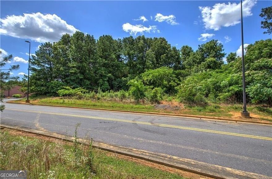 Commercial lot opportunity in Calhoun, GA! This C2 zoned lot, within city limits, offers 1.25 miles proximity to I-75, providing excellent access to both Atlanta and Chattanooga markets. Surrounded by major retail such as Kroger, Walmart, The Home Depot and Ross and restaurant chains, this site benefits from high traffic and visibility. All city utilities are readily available, streamlining the development process. This is a chance to invest in a growing regional economy with strong development potential.