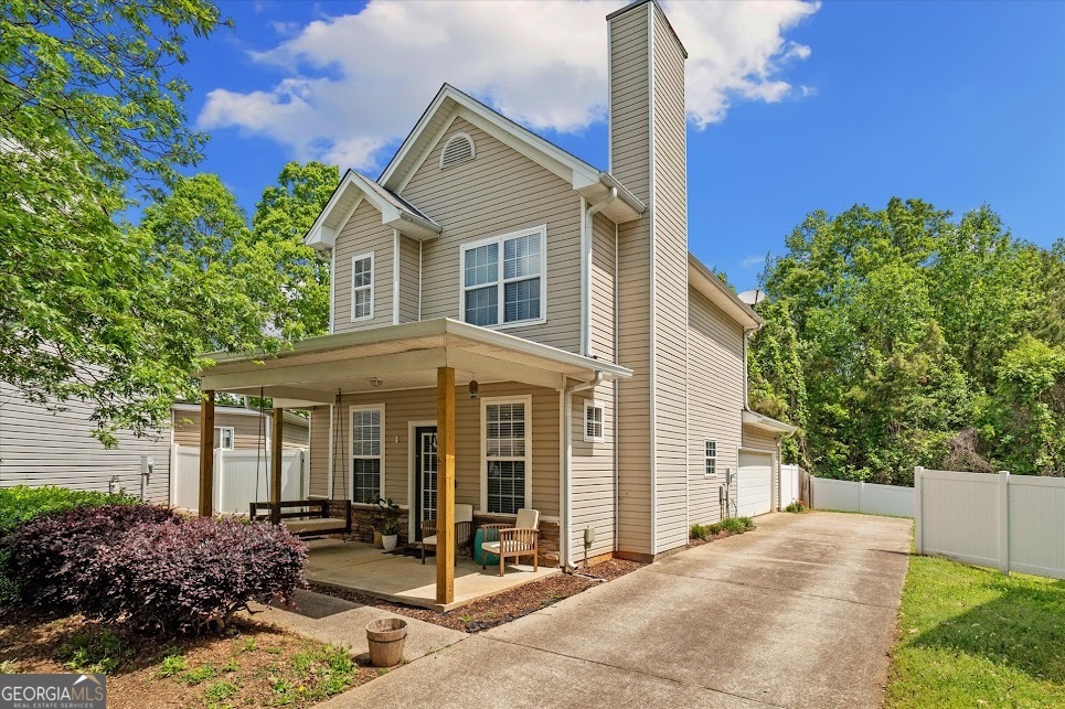 Just a walk's distance from Downtown Carrollton- a charming 3-bedroom, 2.5-bath home that checks all the boxes for space, comfort, and convenience. Nestled on a corner lot in an established neighborhood, this two-story gem offers 1,610 square feet of well-designed living space. Inside, you'll find an open-concept layout that connects the kitchen, dining area, and living room, complete with a cozy fireplace- perfect for hosting or relaxing with family and friends. A convenient half bath on the main level is great for guests, while the upstairs laundry closet keeps daily chores easy and centralized. All bedrooms are located on the upper level, offering a private retreat from the main living areas. The spacious primary suite features tray ceilings and an en suite bathroom with a shower/tub combo and vanity with extra storage- your own peaceful escape after a long day. Two additional bedrooms share a Jack & Jill bathroom, providing a smart setup for family or guests. Step outside to enjoy a fully fenced backyard- ideal for weekend barbecues, entertaining, or simply unwinding in your own slice of the outdoors. The attached garage adds convenience with extra storage and parking. Located just one mile from all the action at Adamson Square- including shopping, dining, and community events. You'll love the blend of small-town charm and modern living. Plus, you're only minutes from UWG, Lakeshore Park, Lake Carroll, and the new pickleball courts!