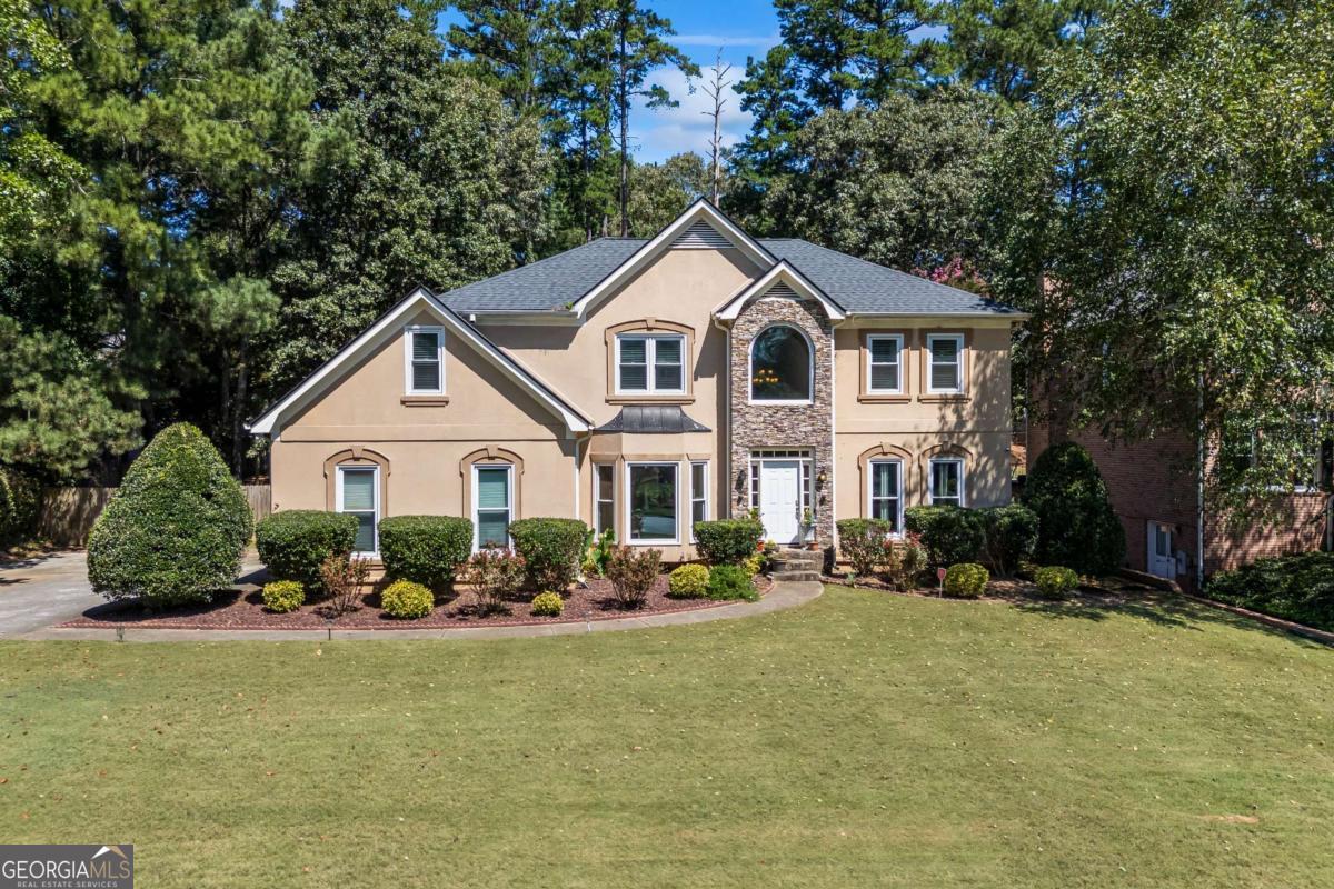 Welcome to this stunning 4 Bed / 3.5 Bath home! Step inside and be greeted by tall ceilings and an impressive floor-to-ceiling brick fireplace that anchors the living space with warmth and character. The spacious primary suite is a true retreat, offering ample room to unwind along with a private ensuite designed for both relaxation and convenience. The open layout flows seamlessly between the living, dining, and kitchen areas, creating an inviting atmosphere for gatherings and everyday living. With four well-appointed bedrooms and multiple baths, this home provides plenty of room for all! Every detail, from the hardwood flooring to the overhead cat-walk - makes this property stand out as both functional and beautiful. Don't miss your opportunity to own this remarkable home - schedule your showing today!