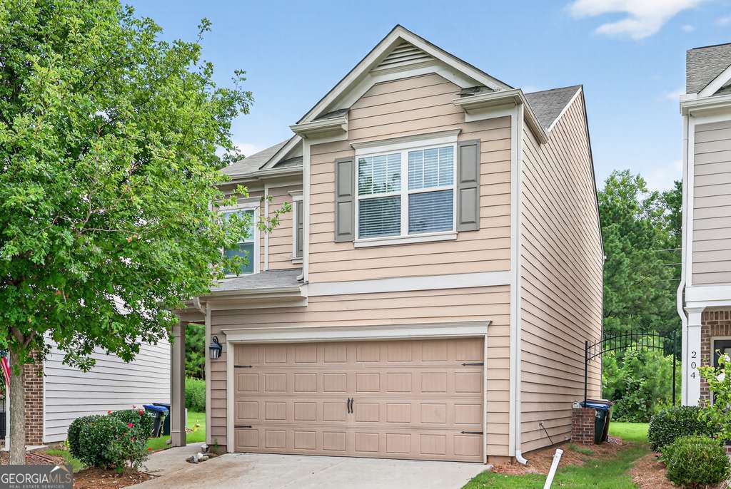 Welcome to 208 Highland Pointe Circle, a freshly updated 4-bedroom, 2.5-bath home offering 1,803 square feet of comfortable living space in the desirable Highland Pointe community. Featuring all new paint and carpet throughout, this home is truly move-in ready. Ideally located with direct access to GA-400, you are just minutes from Dawsonville's top shopping outlets, dining, and entertainment. The covered front entry and professional landscaping create an inviting first impression. Inside, the foyer opens to a spacious family area with clear sightlines to the updated kitchen. The kitchen boasts granite countertops, stainless steel appliances, a large center island, and bar seating-perfect for both everyday living and entertaining. The level backyard provides an excellent setting for outdoor gatherings and recreation. Upstairs, the expansive primary suite features vaulted ceilings, a walk-in closet, and a spa-like en-suite bathroom with double vanities, a soaking tub, and a separate shower. Three additional bedrooms and a full bath upstairs. Residents of Highland Pointe enjoy access to community amenities including a swimming pool and playground. With its fresh updates, versatile layout, and prime Dawsonville location, this property stands out as an excellent opportunity.