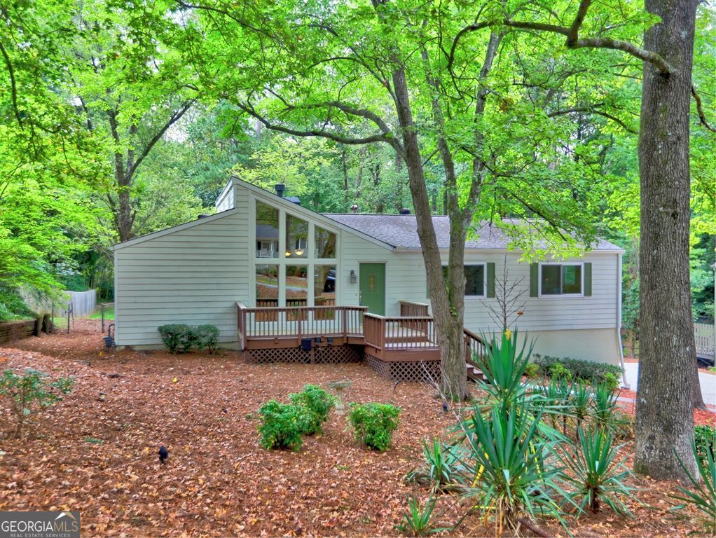 Charming ranch home with basement, move-in ready! Open and spacious with cathedral ceiling in the family room; stone fireplace. Updated kitchen with stainless appliances; breakfast bar and separate breakfast area. Inviting screened porch, perfect for relaxing! Three large bedrooms with ceiling fans. Partial unfinished basement with tons of storage. Large garage area; new driveway with oversized parking pad accommodating multiple vehicles. Amazing back yard, level and private, with area for garden and firepit. Convenient storage shed. Home is in pristine condition, new paint, new carpet, move-in ready! Low maintenance Hardi plank exterior. Convenient to shopping and awarding-winning Pope High School.