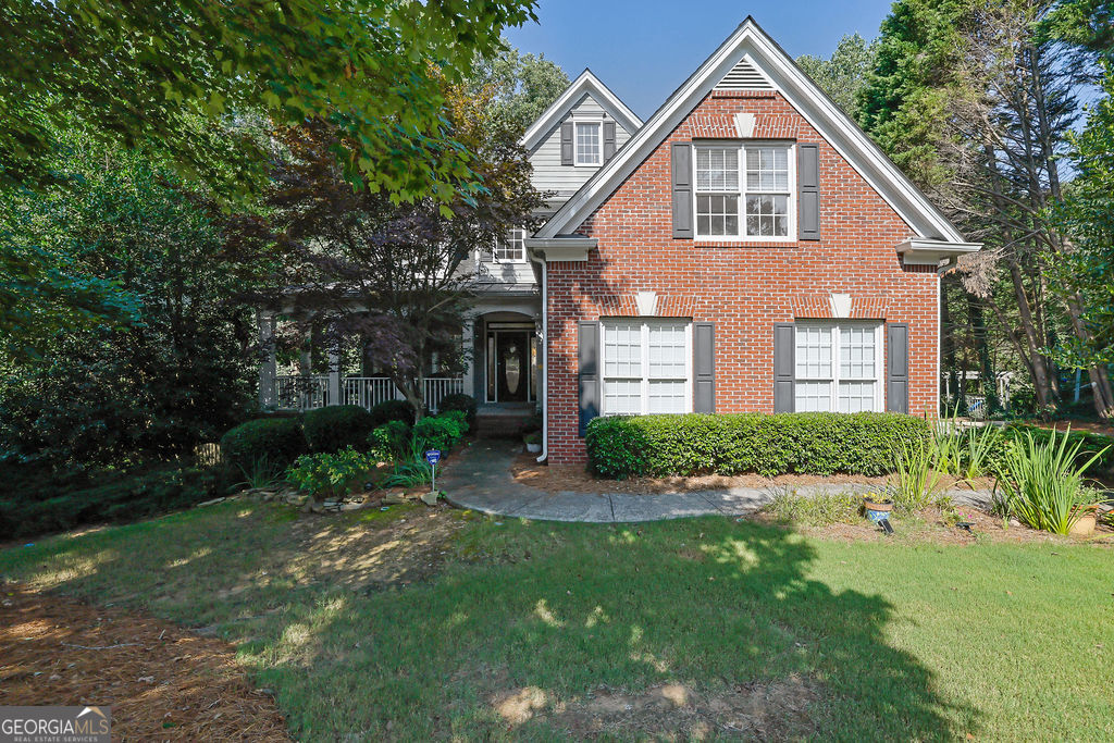 Welcome to this beautifully appointed home located in the sought-after Hamilton Mill community. Featuring timeless hardwood flooring and coffered ceilings that add a touch of sophistication, this spacious residence offers the perfect blend of comfort and style. The formal dining room is ideal for entertaining, while the chef's kitchen boasts generous counter space and overlooks the inviting family room-perfect for everyday living and gatherings. Enjoy serene views from the back deck, which overlooks a wooded backyard and a tranquil creek, offering privacy and a peaceful retreat. Inside, the laundry room is thoughtfully designed with built-in storage and expansive countertop space for convenience. The primary suite is a true sanctuary with a recently renovated spa-like bathroom featuring a stand-alone soaking tub and a custom tiled walk-in shower. The finished basement offers flexible living space, including an additional bedroom, full bath, and living area-ideal for guests, in-laws, or a private retreat. Step outside to the covered patio, perfect for outdoor entertaining year-round. Seller is offering a $10,000 allowance toward paint and carpet-allowing you to make this home your own! Don't miss this exceptional opportunity to live in one of Gwinnett County's premier communities with top-rated schools, amenities, and easy access to shopping and highways.