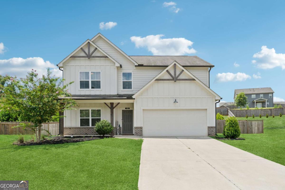 OPEN HOUSE SATURDAY 7/26, 1-3PM & SUNDAY 7/27, 2-4PM. Welcome to this beautifully upgraded and energy-efficient 5 bedroom, 3 bathroom home nestled in the heart of Acworth, GA and just built in 2020. Situated on a premium, level lot, this residence boasts over 2,300 square feet of thoughtfully designed open concept living space, complete with more than $50,000 in upgrades. From the moment you arrive, you'll be impressed by the inviting curb appeal, highlighted by a charming front porch and a two-car garage. Step inside to discover luxury vinyl plank flooring throughout the main level, and a bedroom or dedicated office space ideal for remote work or quiet study on the main level. The open floor plan effortlessly connects the living, dining, and kitchen areas, creating an ideal space for entertaining. The cozy family room is centered around an upscale fireplace flanked by custom built-in shelving and topped with a beautiful wood mantle. The chef-inspired kitchen is a true showstopper, featuring an oversized island, white cabinetry, quartz countertops, stainless steel Whirlpool and KitchenAid appliances, a white subway tile backsplash, and stylish fixtures. A spacious dining area flows to the covered back patio, perfect for relaxing evenings or weekend gatherings. Upstairs, a large loft offers flexible living space for a media room, playroom, or secondary family area. Generously sized secondary bedrooms and a full bathroom with double vanities and a tub/shower combo ensure comfort and convenience for family or guests. The oversized primary suite is a peaceful retreat, complete with a spa-like ensuite featuring double vanities, a soaking tub, a frameless glass shower, and a large walk-in closet. Additional highlights include a fully fenced backyard, updated lighting throughout, and thoughtful design details at every turn. Built with energy efficiency in mind, this Energy Star and EPA Indoor AirPlus certified home. Located just minutes from top-rated schools, shopping, dining, parks, and trails, this move-in ready home is a rare find in a prime Acworth location. Brookstone Golf & Country Club offers optional Swim/Tennis membership for residents of Brookstone West along with swim team, onsite restaurant and pickleball courts. Top rated amenities at your convenience-making this not just a home, but a lifestyle. Top rated schools await you. Just minutes to Downtown Acworth, Lake Allatoona and Lake Point Sports Complex. YMCA just 10 minutes away. Pitner Park just around the corner with mountain bike trails and walking trails.