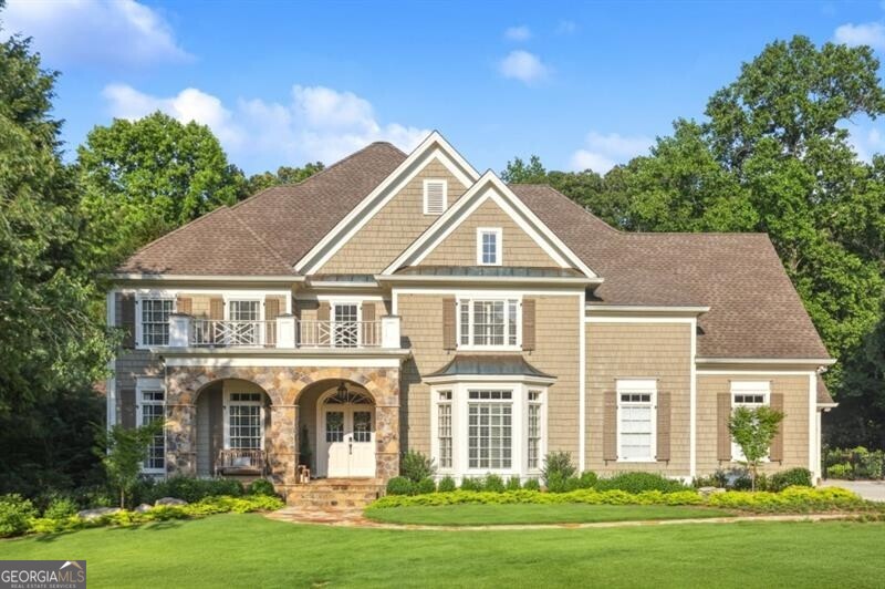 This stunning custom-built Rick Greene residence blends timeless elegance with the latest in smart home technology and luxurious upgrades. Located just steps from the neighborhood swim and tennis amenities, this beautifully designed home offers a renovated main-level primary suite featuring heated marble floors, a steam shower, a freestanding soaking tub, quartzite countertops, and fully customized closets-your private spa retreat. The gourmet chef's kitchen is a dream come true, outfitted with top-of-the-line Wolf and Thermador appliances, a Sub-Zero refrigerator, an oversized island, and matching quartzite counters and backsplash. Upstairs, you'll find three spacious en suite bedrooms with recently updated bathrooms that maintain the home's elevated style. As seen on HGTV, the fully finished terrace level is perfect for entertaining, complete with a custom bar (with ice maker, dishwasher, and beverage fridge), media room, billiards room, guest suite, home gym, and a walk-in 200-bottle refrigerated wine cellar. Step outside to enjoy the professionally designed stone patio with a gas fire pit and the covered porch with a fireplace-ideal for year-round enjoyment. With every modern convenience and curated design detail, this home is move-in ready and truly one-of-a-kind. Don't miss your chance to own this masterpiece of comfort, technology, and style.