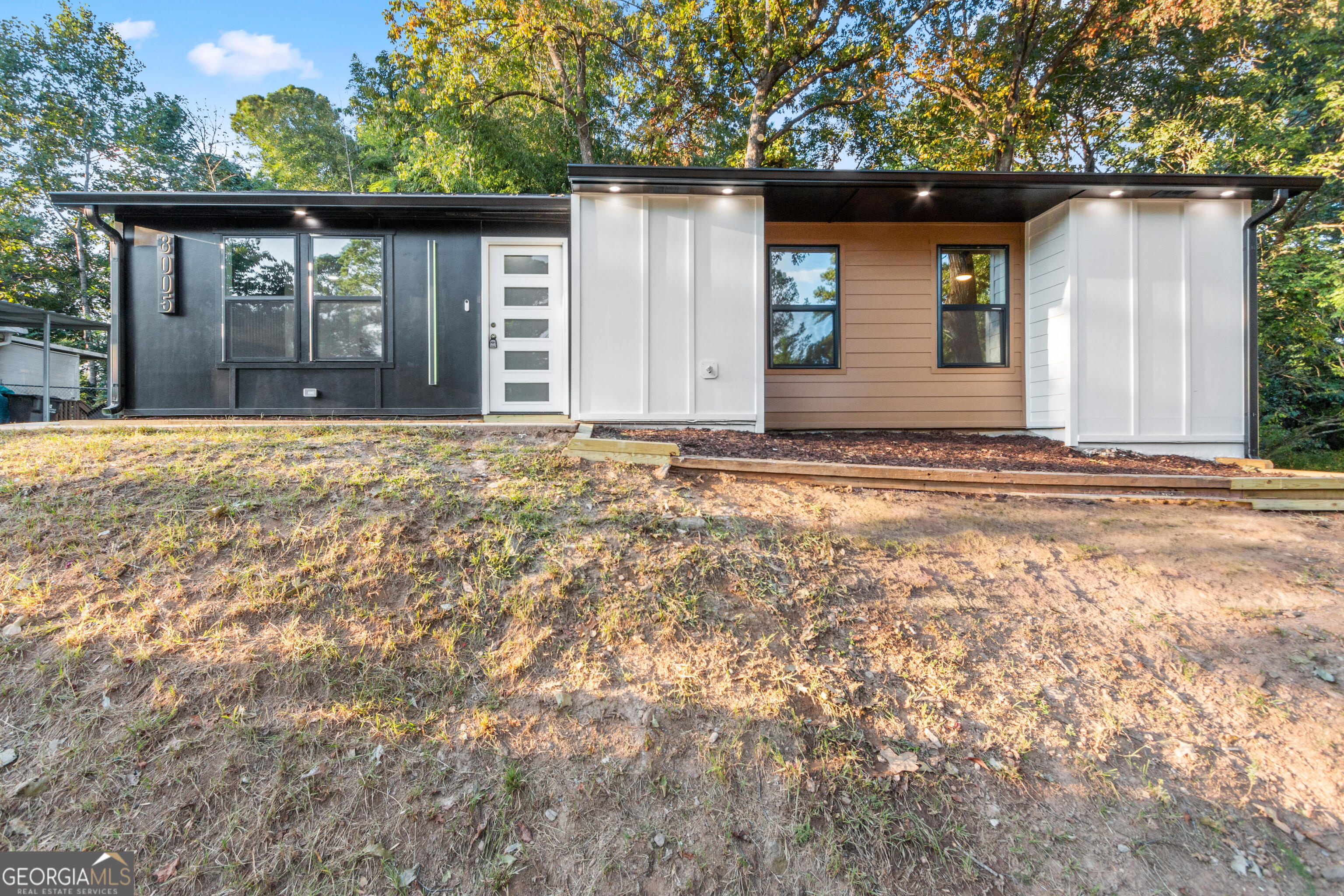 This beautifully remodeled 3-bed, 2-bath home is packed with upgrades and modern finishes that make it truly move-in ready. Step inside to an open layout with sleek modern lighting, a remote-control fireplace, and new windows that fill the space with light. The chef's kitchen offers Samsung appliances, quartz countertops, and a tile backsplash. The master suite is a true showstopper, featuring a spa-like bathroom with a double vanity, designer tile, and jaw-dropping modern finishes. Both bathrooms are fully updated, and a brand-new deck makes entertaining easy. This is more than a home-it's a lifestyle upgrade. Don't miss your chance to make it yours!