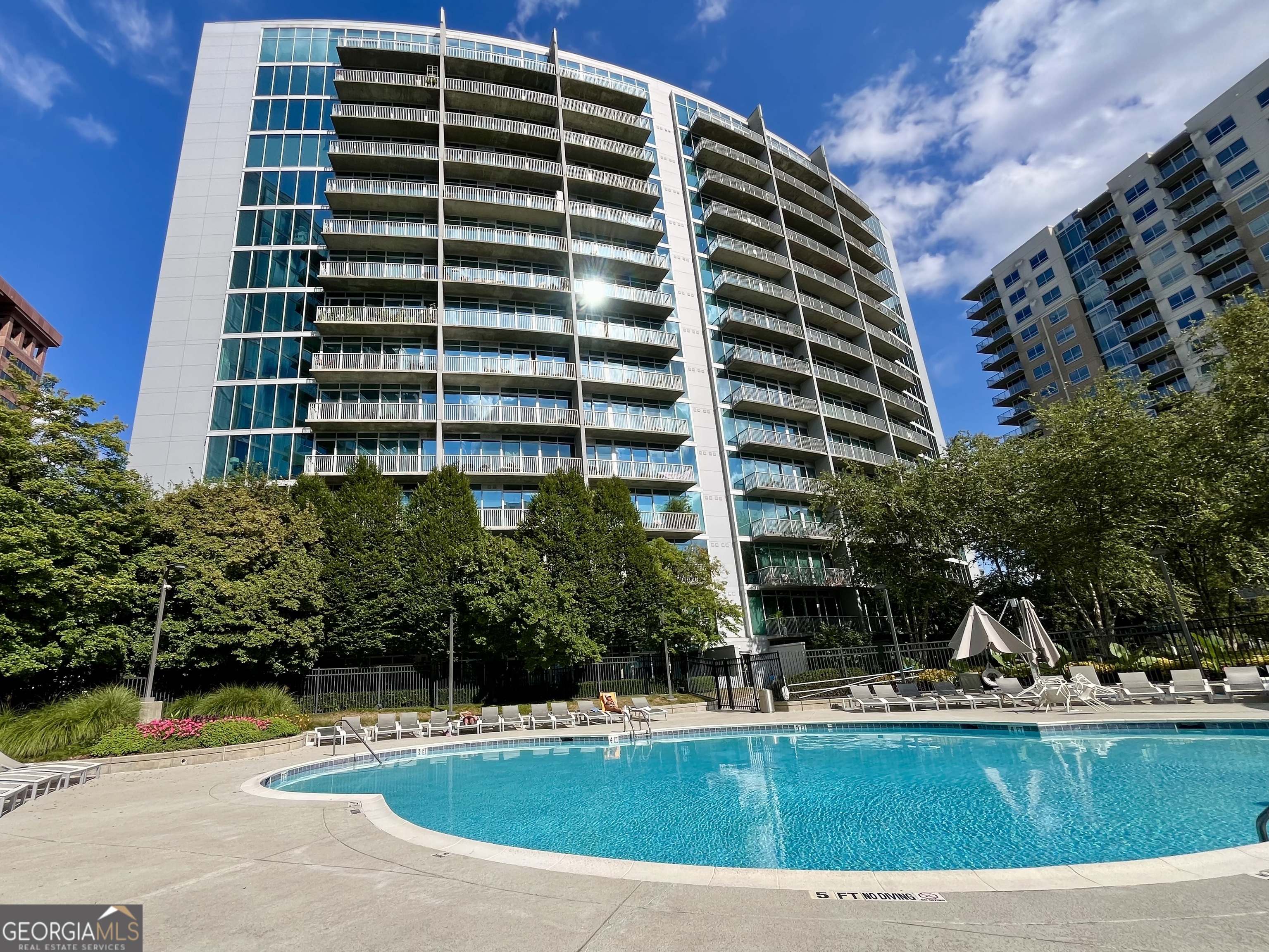 Intown city-living with resort style amenities awaits you at Plaza Midtown, a modern high-rise condominium building in Midtown Atlanta. This move-in ready, furnished condo with 2 bedrooms and 2 bathrooms has a roommate style floor plan and floor-to-ceiling windows providing a view of vibrant city lights from all rooms. Entertain guests in the open-concept living room to the kitchen island with adjacent dining table and additional seating. The stylish kitchen has stainless steel appliances, granite countertops, tile backsplash and sleek dark cabinets. The primary bedroom suite offers a city view and ensuite bathroom with double vanities, tub/shower combination and tile flooring leading to a custom walk-in closet. The condo is offered furnished and includes a stackable washer/dryer, a coveted Storage Unit (10'x5'), and an assigned, secure parking space. Plaza Midtown has an impressive lobby entrance with 24-hour concierge and security. The amazing amenities include the resort-style pool, fitness center and a clubroom available for private gatherings. Location is key with direct elevator access downstairs to Publix and easy walkability (or take a quick scooter ride) to restaurants, shopping, Atlanta Beltline, Piedmont Park, Marta, GA Tech, NCR Corporation, PWC, Alston and Bird, the Fox Theatre, Mercedes Benz Stadium, Phillips Arena, Centennial Park, Atlantic Station, and many other Atlanta landmarks.