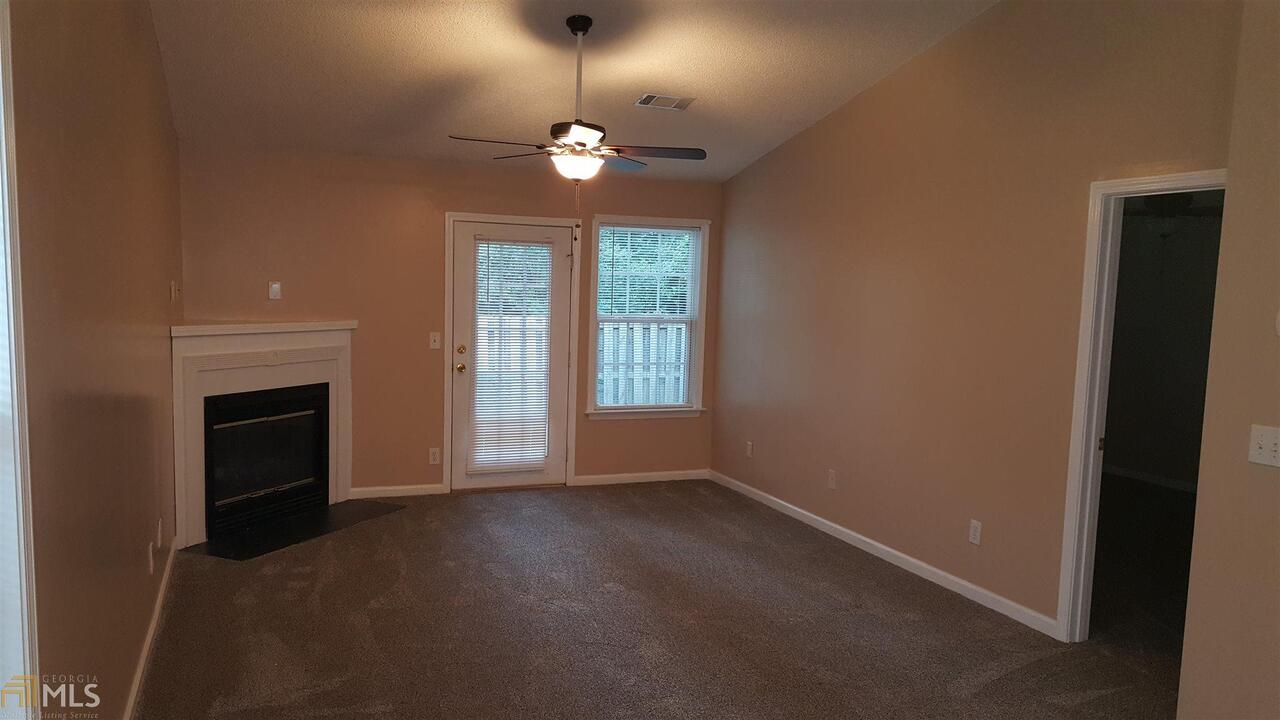 Spacious 2 bedroom townhome located in a great neighborhood. Renters usually stay at least 3 years because they love the neighborhood. It's a quaint townhome on a roommate floor plan. Private fenced courtyard. Galley style kitchen (newly painted cabinets), new floors in bathrooms, resurfaced countertops in kitchen and bathrooms. Family room/dining room combo offers plenty of room and many configurations to suit your life style. Parking pad accommodates 2 vehicles. Street front landscaping included. Tenant is required to maintain the courtyard. Apply online: www.pryorproperty@managebuilding.com or call 678-787-0338