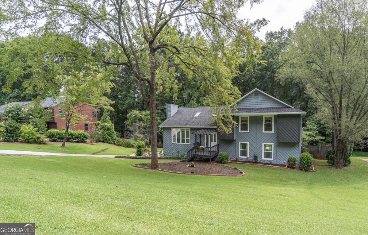 Located in the Brookwood school cluster, this home is nestled in a quiet cul-de-sac, has hardwood floors on the main level, LVP upstairs, fully renovated bathrooms, a new roof, a new HVAC system, gorgeous primary bathroom, AND two full walk-in closets in the primary suite. There is a large finished basement with a bedroom and a half bath. The basement exits onto one of the large decks. The three massive, sprawling decks over looking the flat back yard are great for relaxation and entertaining. The back side of the property is wooded, private, and has a nice creek to explore. This is such a peaceful, serene property that you will have to see it to believe it. Come check it out today!