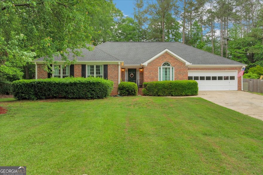 This beautiful ranch home is located in the highly sought after neighborhood of Lee's Crossing. This active neighborhood offers swimming, tennis, and pickleball courts. The house has been fully renovated and freshly painted inside. You enter into the front foyer to a great room with a vaulted ceiling and a brick fireplace. From the great room, it flows into a magnificent sun room with large windows overlooking the back yard. The kitchen is equipped with a gas stove and KraftMaid custom cabinets with gorgeous granite counters. There is an open flow from the kitchen to the dining room and the keeping room. There is a second fireplace in the keeping room. The laundry room that holds new upper cabinets and wash sink leads out to the oversized garage with room for a workshop. There are three very spacious bedrooms. The master suite has a trey ceiling with a large custom en-suite. The en-suite has a double sink marbled vanity, a large walk-in shower with a free-standing, soaking tub. The closet is spacious and found within the en-suite. The two spare bedrooms have ample closet space. All bedrooms had new carpet installed two years ago. The spare bath has a granite countertop with one sink. The shower/tub has a glass door. The bathroom also has a linen closet. There are two attic entrances with a huge storage area. The back yard is a lovely oasis. The new deck spans most of the back of the house. The deck partially wraps around the 1,000 gallon Dr. Wellness Swim Spa. A few steps off the deck, there is a patio with a fire pit to roast marshmallows and gaze at the stars. There is a shed perfect for storing lawn equipment. This property is a must-see in a great neighborhood!