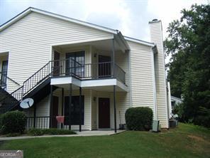 LUXURY AT THE PERFECT SIZE AND THE PERFECT PRICE!! This one bed, one bath condo nestled in the quiet and serene Windchase community is ideal for those looking for an updated spacious unit with new carpet and blinds! This CONDO is made for one, but more than enough space for two! Home features: Marble countertops, breakfast bar with large dining room, living room, cozy fireplace, oversized master, large walk-in closet, updated light fixtures with ceiling fans, large outdoor storage unit, and iron security door. This is a swim tennis community with a clubhouse and ample parking for guest! Come and enjoy a community that is centrally located to 285 and one mile from Stone Mountain Park!!