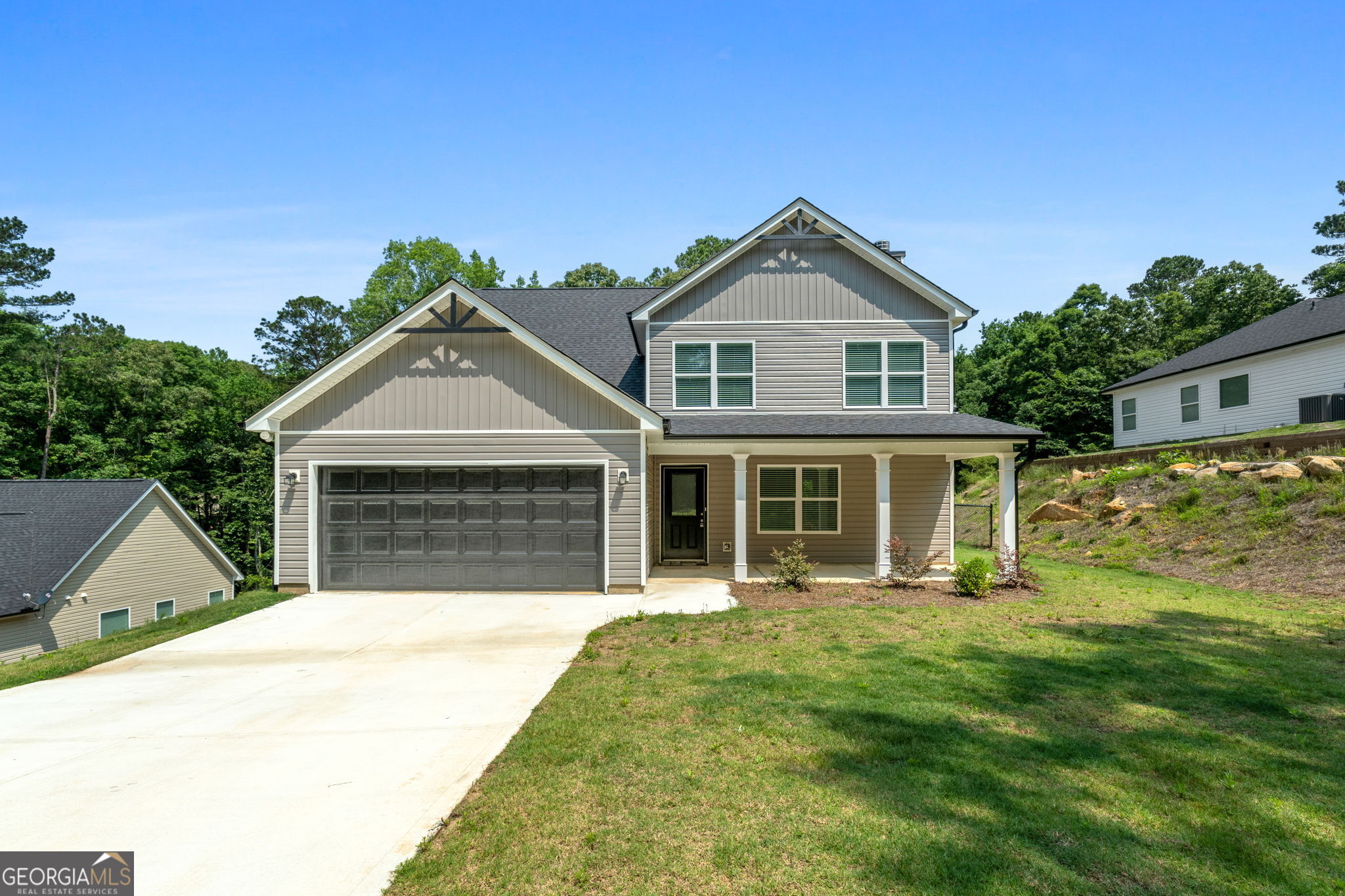 Discover this stunning 3-bedroom, 2.5-bath home with a spacious 2-car garage, thoughtfully designed for comfort and style. The kitchen features granite countertops, a large island, and modern shaker-style cabinets. Enjoy the blend of luxury vinyl plank and carpet flooring throughout, along with a generous walk-in closet, double vanity, and a cozy fireplace. The home is topped with durable 30-year architectural shingles and boasts a beautifully sodded front yard. Nestled in the sought-after Turtle Cove community on Jackson Lake, you'll have access to top-tier amenities including golf, swimming, tennis, a restaurant and lounge, scenic beaches, and convenient boat ramps. This home truly offers the best of both relaxation and recreation.