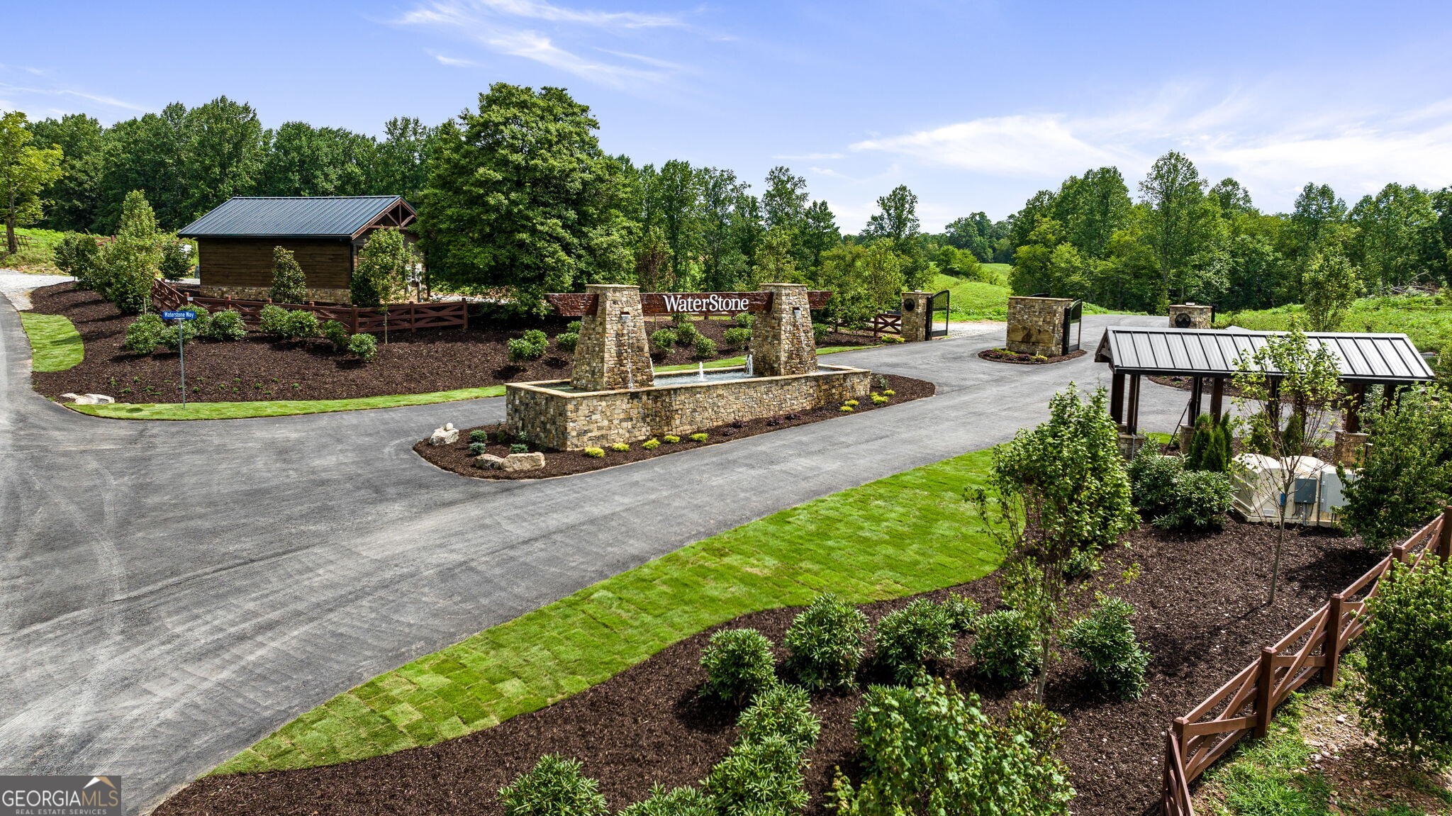 Welcome to Lot 11 Waterstone at Jonica Gap, Blue Ridge's newest and most innovative, design-centric and community centered retreats. This forested and fully-gated private community is an outdoor enthusiast's dream. This deeded creek access lot sits on 1.7 +/- acres with a perfectly level spot for building. With all paved roads, community green spaces, babbling creeks and rapids throughout, each lot with deeded access, sprawling meadows, rolling hills and mountain views   the scenery creates private estate lots for each owner. Each lot is READY TO BUILD, with gentle home sites, all utilities including community water and fiber internet at each lot, and paved roads throughout. Waterstone at Jonica Gap is proud to be the ONLY community in Blue Ridge with an exclusive community clubhouse/wellness house with heated year-round gunite pool, pickleball courts, putting green, fire pit lounge areas, and interior gathering spaces. These amenities are under construction, and we can't wait to welcome you to the community. The community is partnered with some of the area's best builders to bring forth a timeless contemporary rustic facade with homes embracing nature. Designs will feature chalet walls of glass, sprawling outdoor spaces, open-concept living, garage and ADU addition capabilities, and turn-key furniture packages with an in-house design team. Homes in this community will be made perfect for full-time living, second homes, or short-term rental investments.
