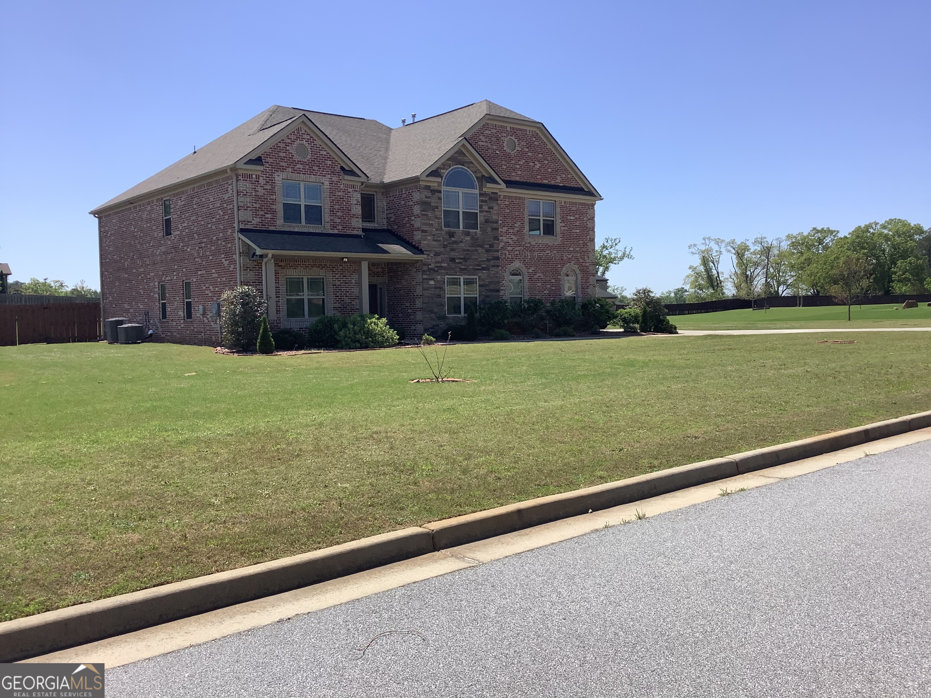BACK ON THE MARKET. Just minutes form the USA Soccer Complex and Trilith Studios. This home offers 4600 plus square feet of impressive living space plus 4-bedrooms, 3.5 bathrooms. Situated on an one-acre lot, the property features four side brick construction and a fenced backyard. Inside. you'll find a two story foyer, an open floor- plan, hardwood floors spans the main level, which include two dedicated offices, two fireplaces, an elegant formal dining room, a living room and a keeping room. The chef's kitchen boasts stainless steel appliances. Upstairs, the primary suite includes a spacious sitting room with a fireplace, a large primary bathroom with double vanities, a soaking tub, a separate shower and a large walk-in closet. Also, there is a loft, two bedroom that share a Jack and Jill bathroom and a third bedroom with it own bathroom.