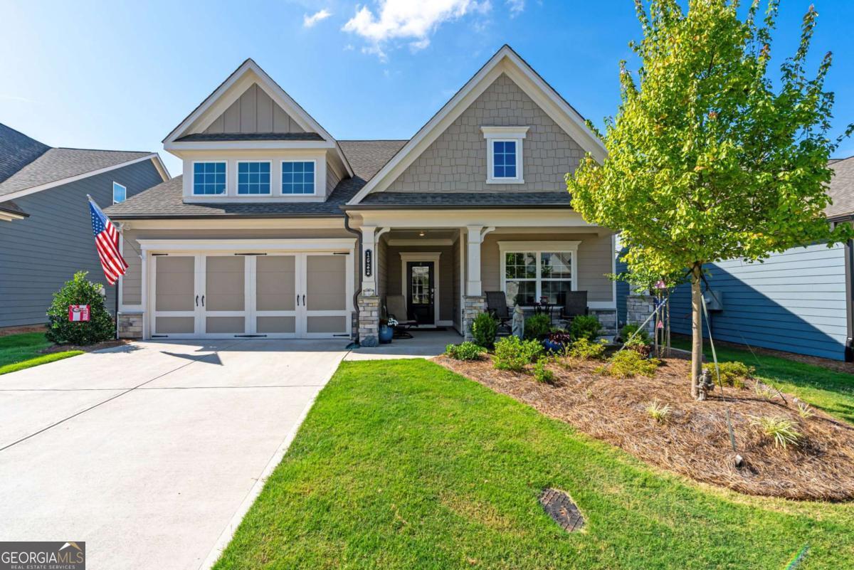 4 bedroom, 3 bathroom ranch-style home with a spacious upstairs loft has it all and is nestled in the sought-after, gated community of Hickory Bluffs off Riverstone Parkway. The main level features everything you need for day-to-day living, including: A chef's kitchen featuring white shaker cabinets, stainless steel appliances, a 5-burner gas cooktop + griddle, built-in microwave/convection oven, wall oven, quartz countertops, and an oversized island with abundant cabinet and pantry space. The gorgeous kitchen is open to the living room adorned with built-in cabinets and shelving that perfectly frame the stately gas fireplace. Also on the main level is the spacious primary suite with ensuite bathroom boasting a zero-entry shower, upgraded glass door, and dual vanities. A versatile study/library makes an ideal office, reading nook, or hobby space. Laundry room, mudroom, and an additional bedroom and full bathroom round out just some of the best mainfloor features of this floorpan! Upstairs leads to the perfect extra hangout space + a guest room and full bathroom. Perfect for hosting friends and family! You'll love the breezy mornings and quiet evenings out on screened-in back porch. The backyard is fenced for tiny humans or four-legged fur babies, either way, it's an added bonus to this beautiful home! Located in a vibrant 55+ community, residents enjoy a resort-style lifestyle with a stunning clubhouse, pool, tennis and pickleball courts, and a full calendar of social activities. HOA includes all lawn maintenance, so you can truly relax and enjoy the good life. This is low-maintenance, luxury living at its best- come see for yourself!