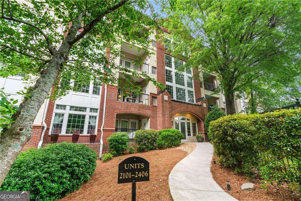 This Renovated Condo is nestled in the coveted, gated community of Habersham Oaks-an oasis in the heart of Buckhead. Recently renovated with all-new hardwood floors, Double Ovens (one conventional and one convection), Energy Efficient Appliances Microwave, Recessed lighting throughout, track lighting in kitchen, Custom built-in shelving, Rain shower, jacuzzi tub, Nest controlled heating/cooling, Brand new water heater, and a Brand new HVAC. The kitchen is a timeless blend of style and function, featuring crisp white cabinetry, sleek stone countertops, and stainless steel appliances-all gracefully overlooking the dining area and welcoming family room. Here, a cozy fireplace and a large picture window create a perfect gathering space, while French doors open to your private balcony-an ideal perch for morning coffee, evening breezes, and quiet reflection amidst lush, natural surroundings. A private storage closet offers added convenience. The expansive primary suite is a tranquil retreat, complete with a generous walk-in closet and a spa-like en-suite bath featuring dual vanities, a soaking tub, and a separate shower. A spacious second bedroom and a beautifully appointed guest bath offer comfort and versatility for guests or a home office. Enjoy the ease of two covered parking spaces and indulge in the community's amenities, including a fitness center, sparkling pool, dog walk area, and a welcoming clubhouse. Just a short stroll from Chastain Park, fine dining, and boutique shopping, this Buckhead gem offers not just a home, but a lifestyle. Don't miss your chance to own a piece of refined Atlanta living